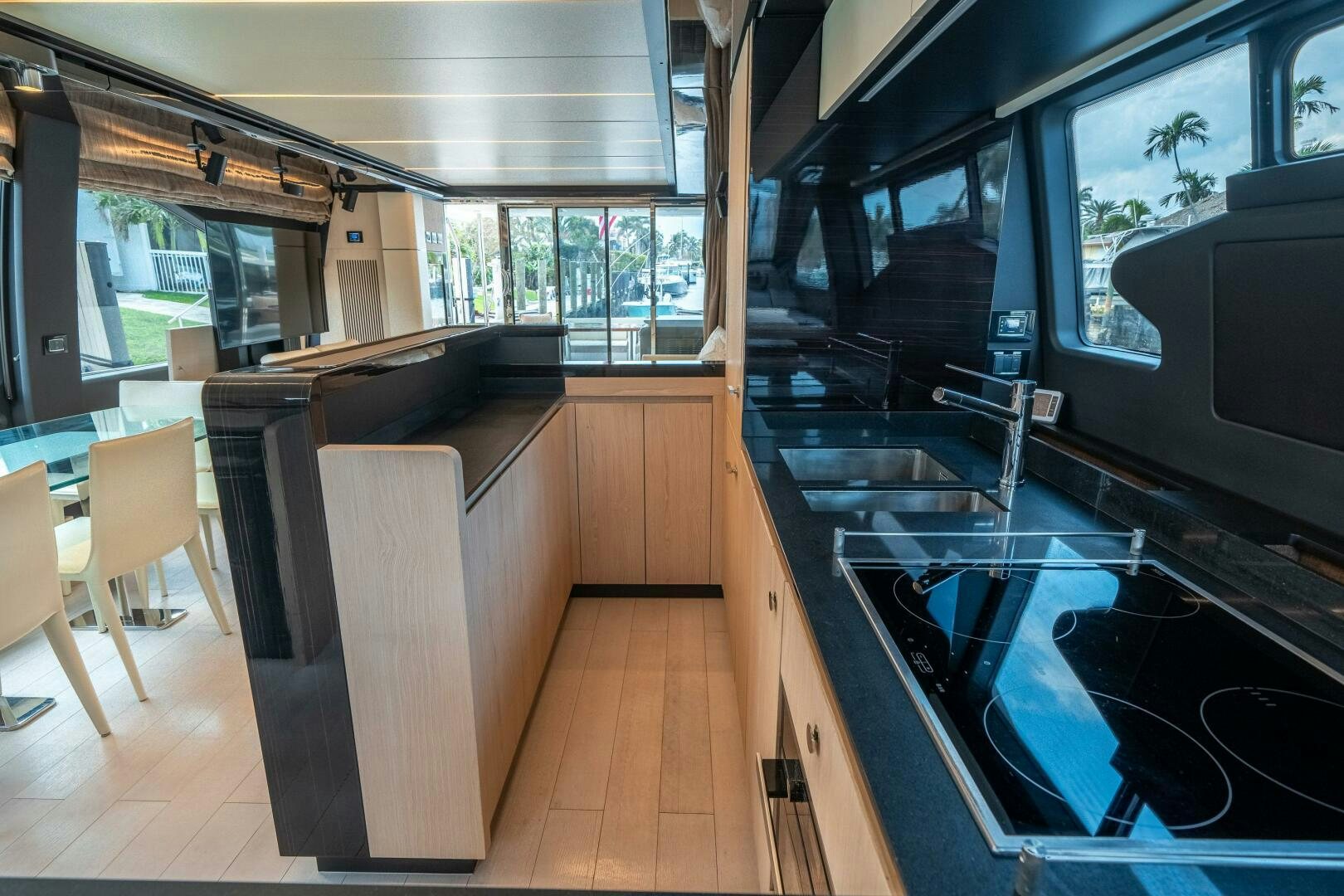 a kitchen with a large glass window aboard VELOCITY Yacht for Sale