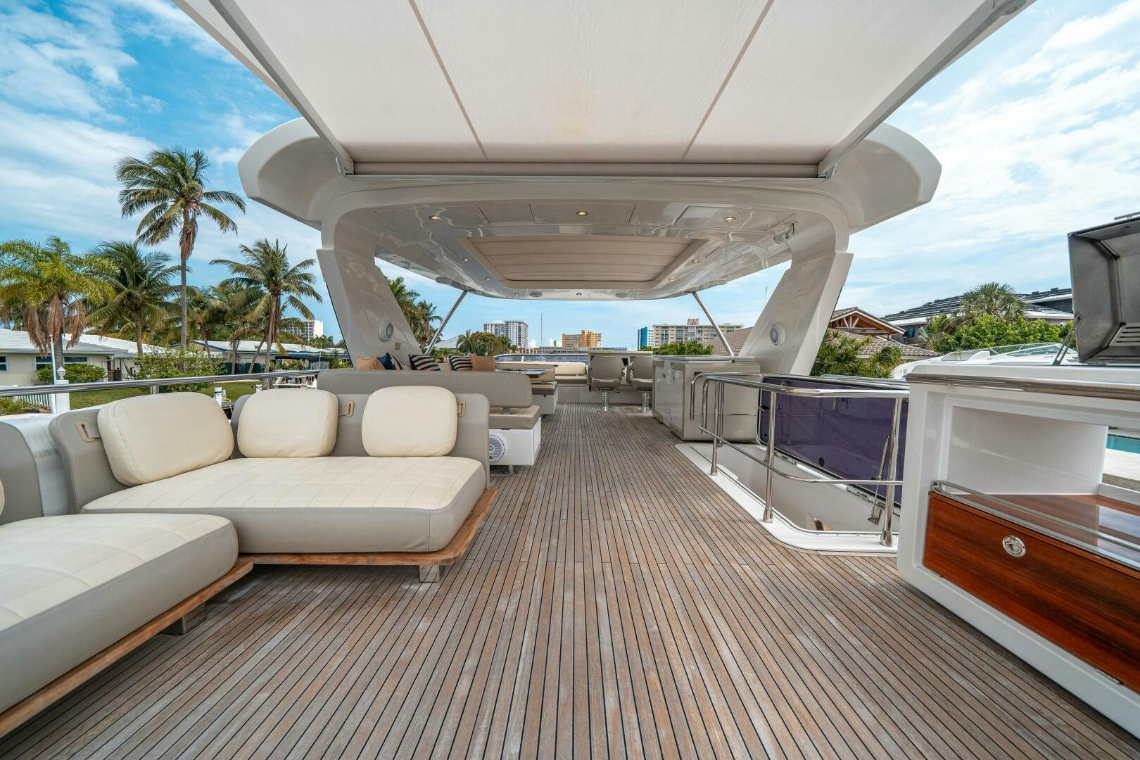 a deck with a couch and a pool aboard VELOCITY Yacht for Sale