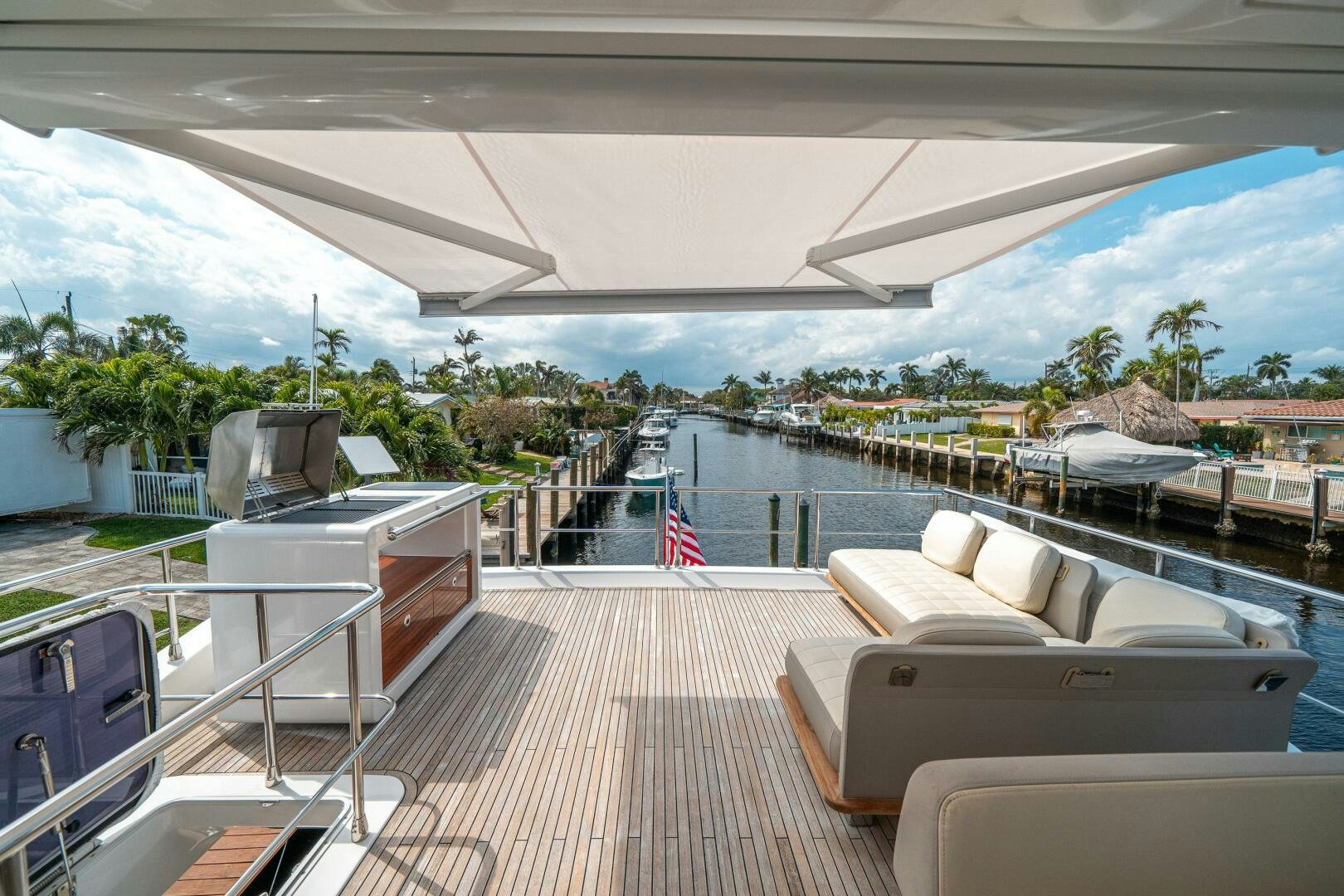 a deck with a deck and chairs aboard VELOCITY Yacht for Sale