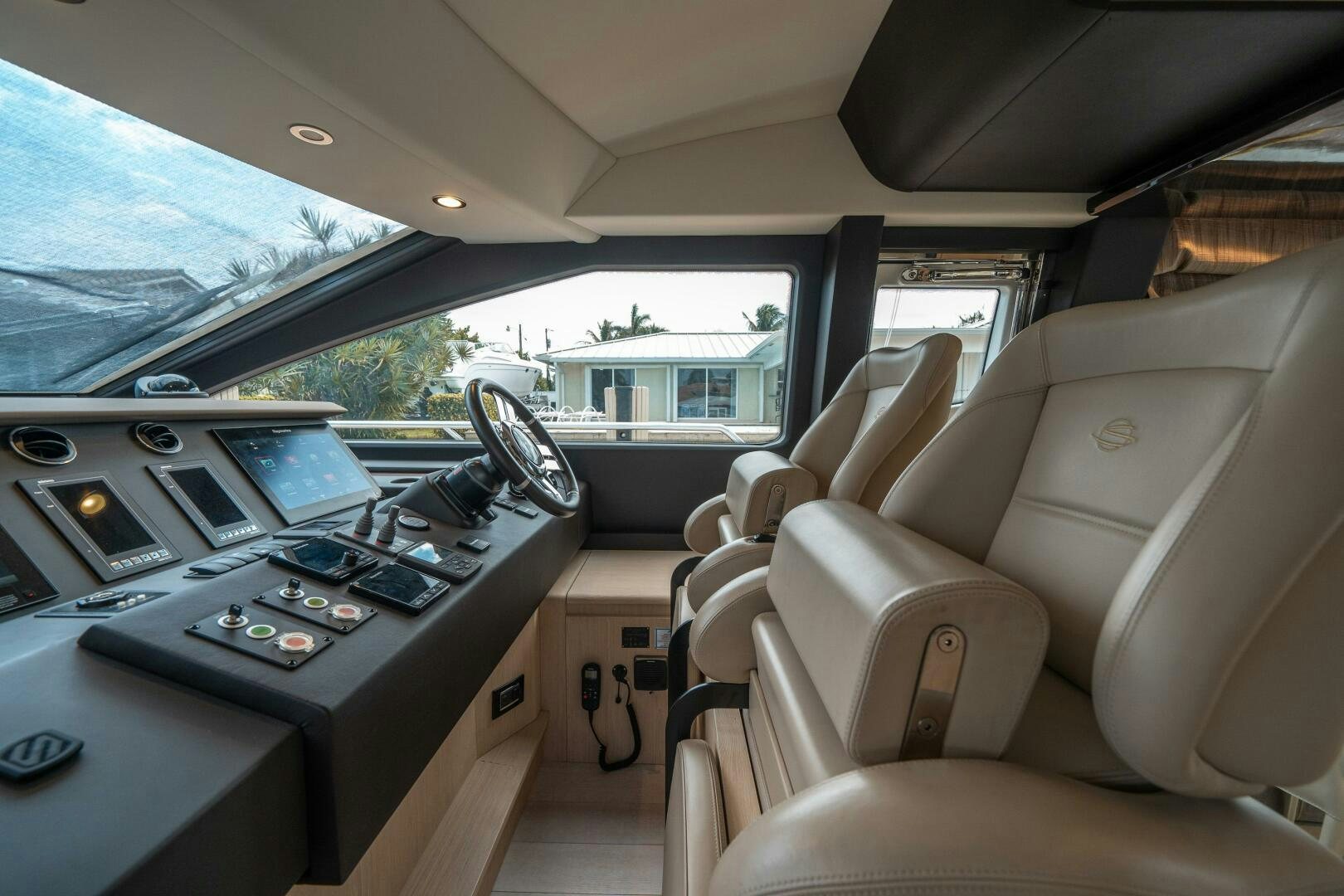inside of a car with a laptop and a desk aboard VELOCITY Yacht for Sale