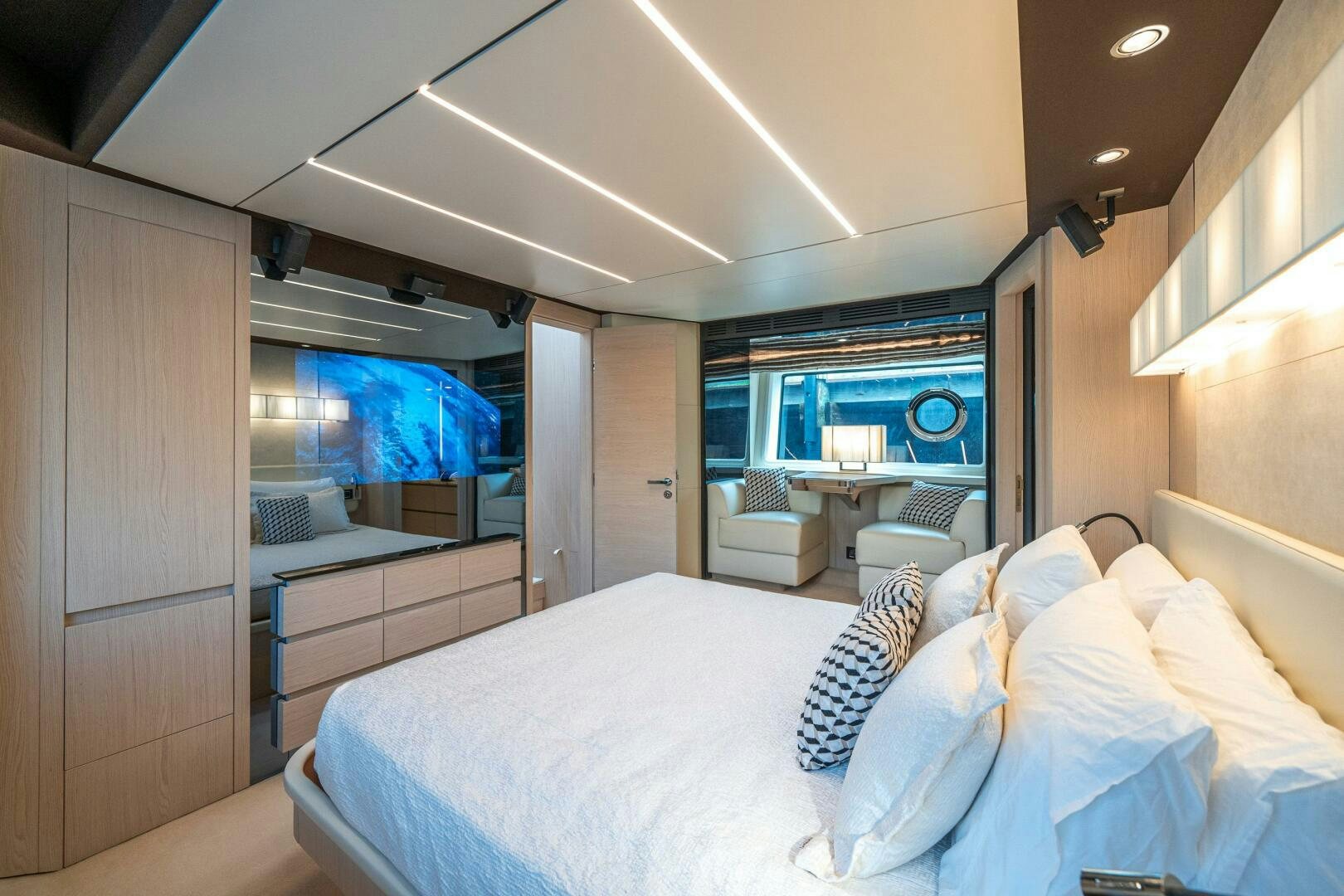 a room with a bed and a window aboard VELOCITY Yacht for Sale