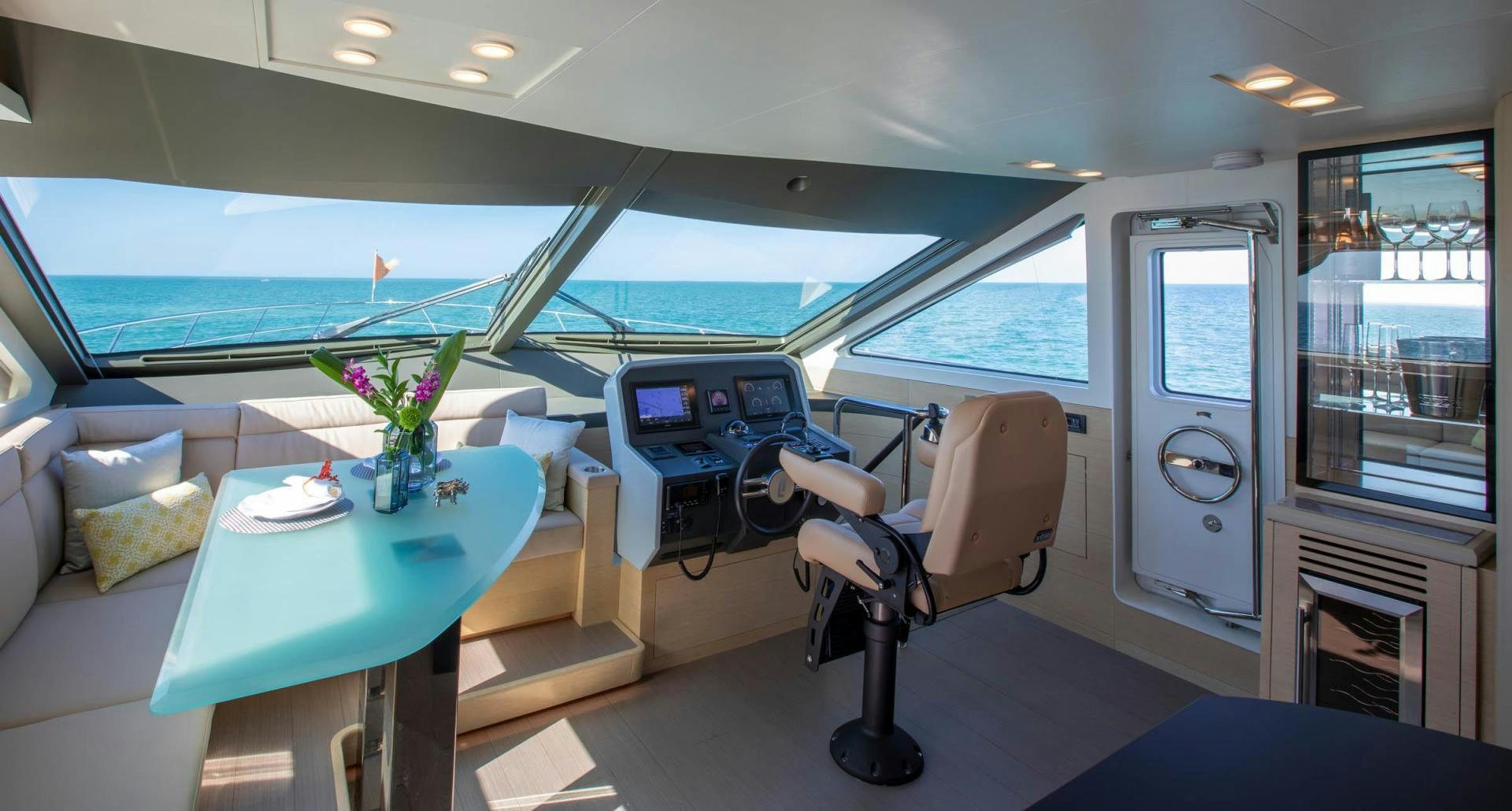 a room with a table and chairs aboard ABSOLUTELY Yacht for Sale