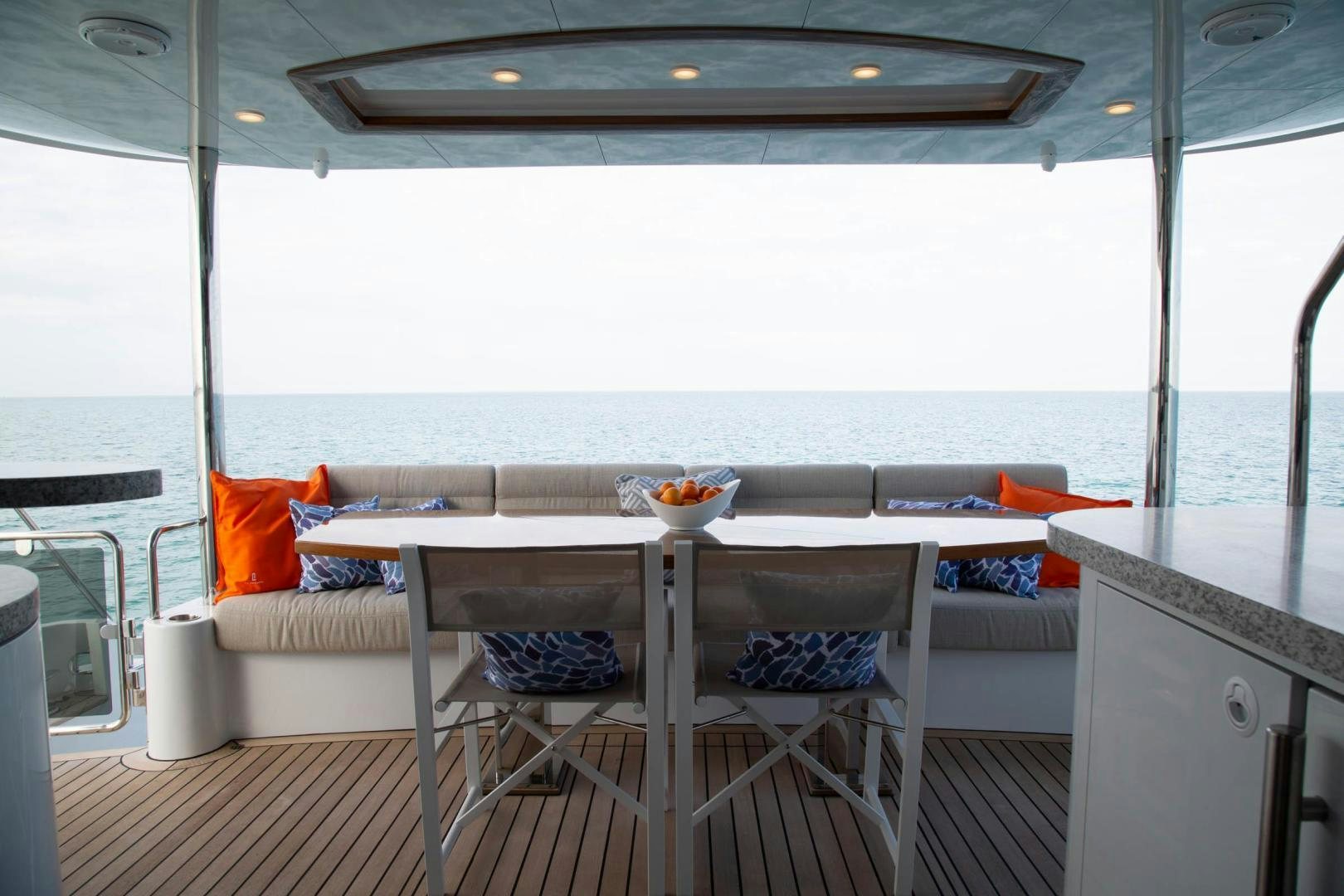a table with chairs on it aboard ABSOLUTELY Yacht for Sale