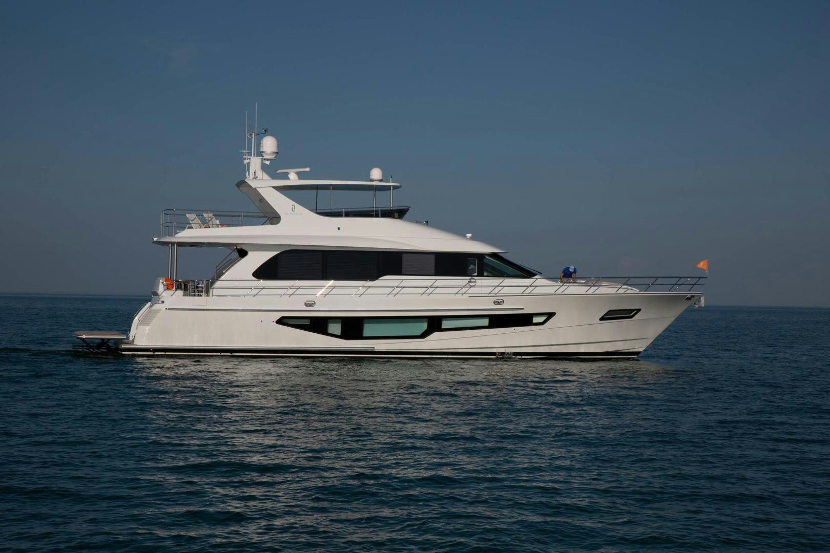 a white yacht in the water aboard ABSOLUTELY Yacht for Sale
