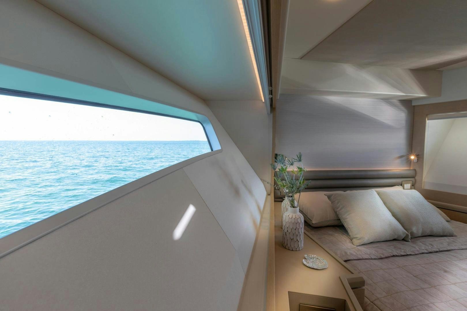 a bed and a table in a room aboard ABSOLUTELY Yacht for Sale