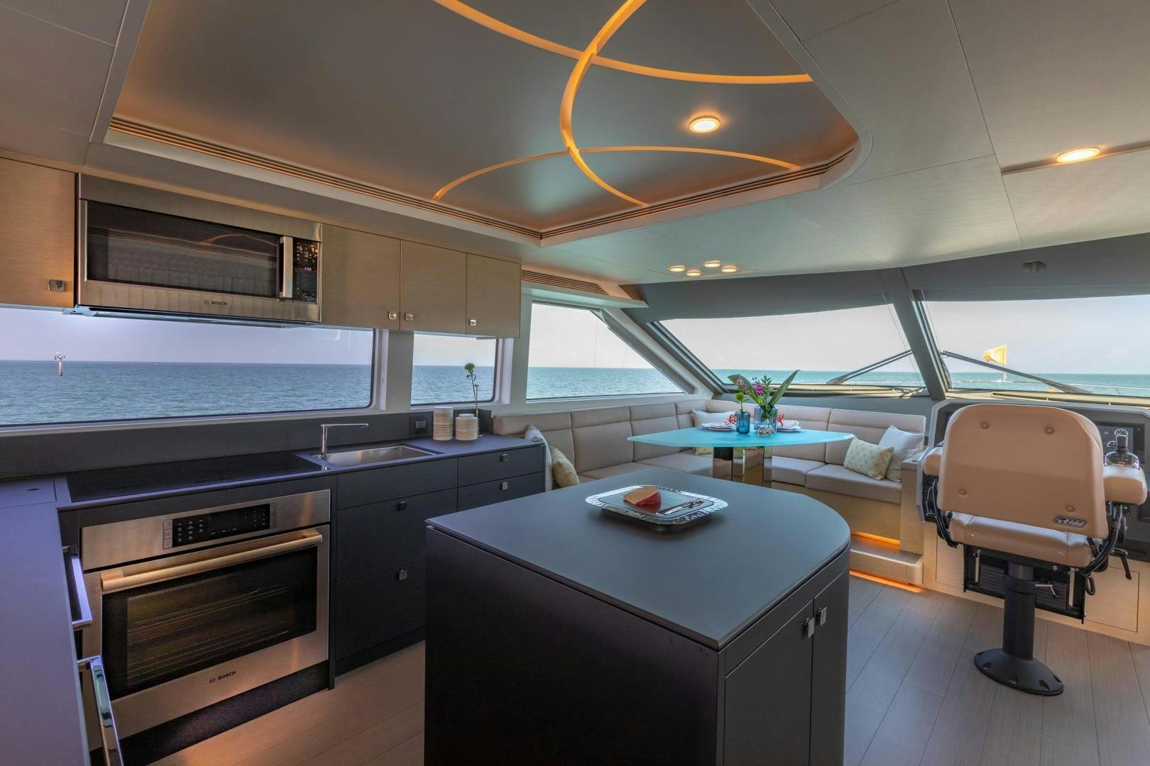 a kitchen with a table and chairs aboard ABSOLUTELY Yacht for Sale