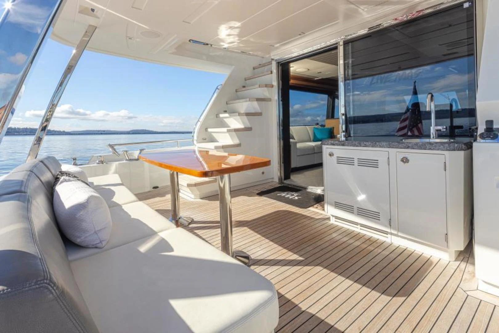 a room with a table and a bed aboard LIV MAS Yacht for Sale