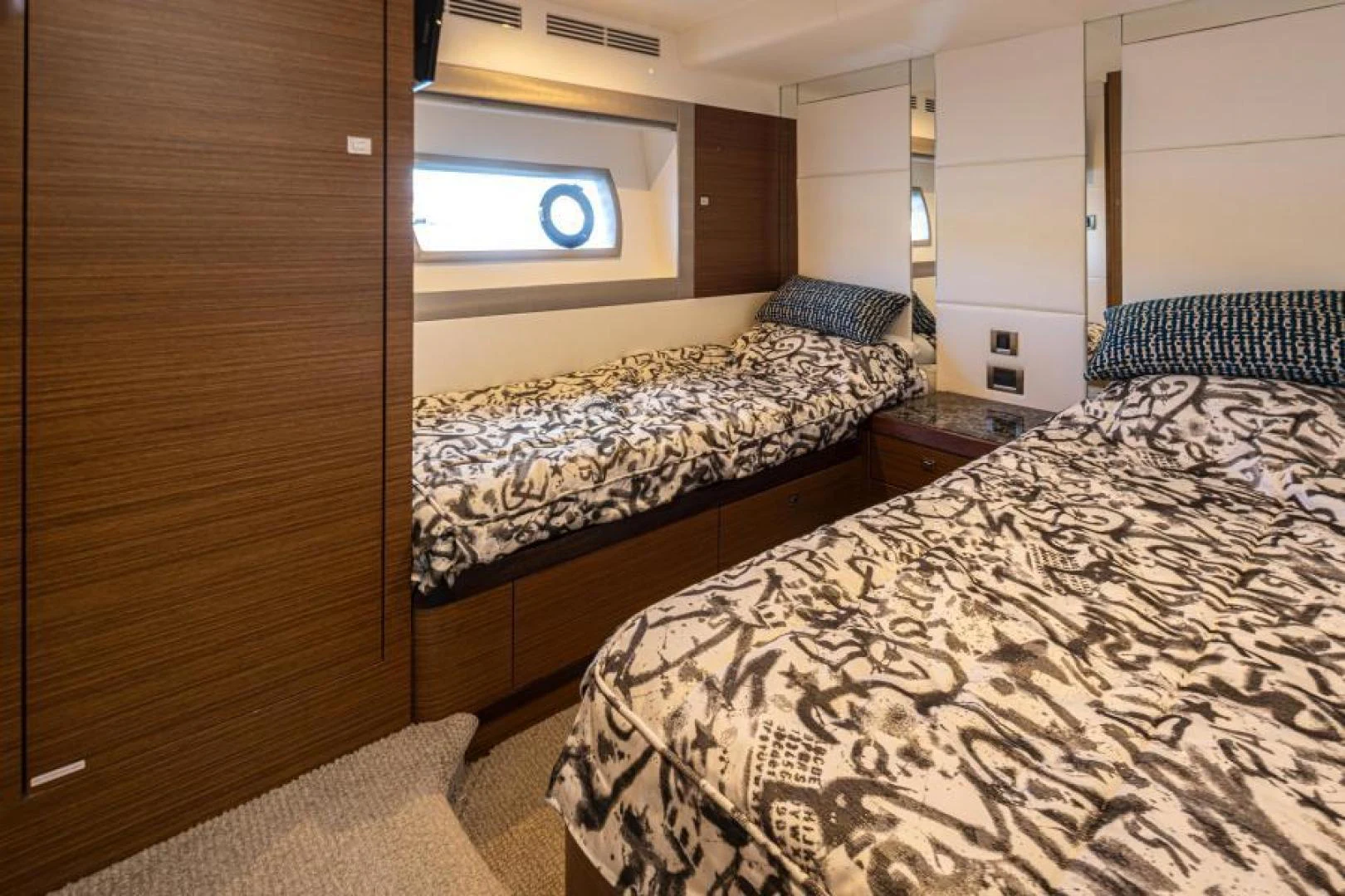 a room with a bed and a wood door aboard LIV MAS Yacht for Sale