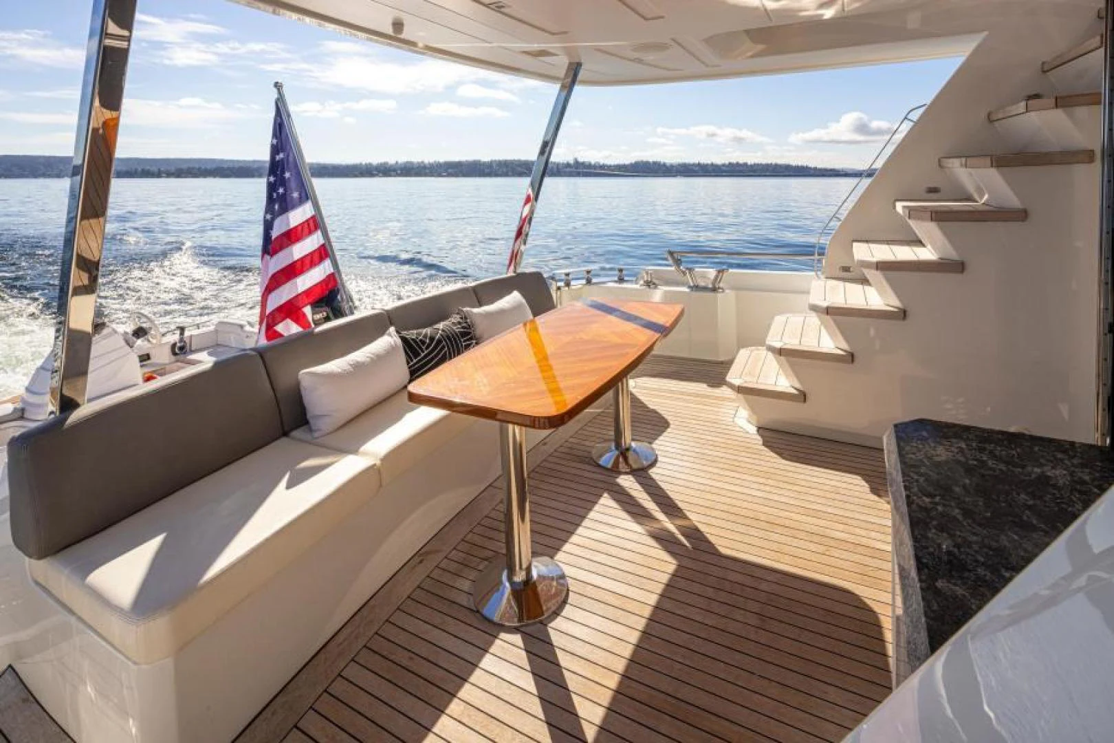 a table and chairs on a boat aboard LIV MAS Yacht for Sale