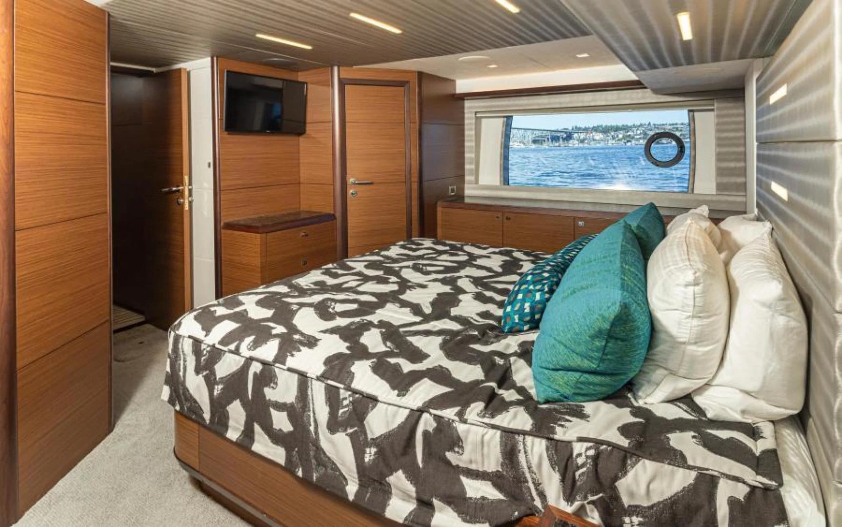 a bed with white sheets aboard LIV MAS Yacht for Sale