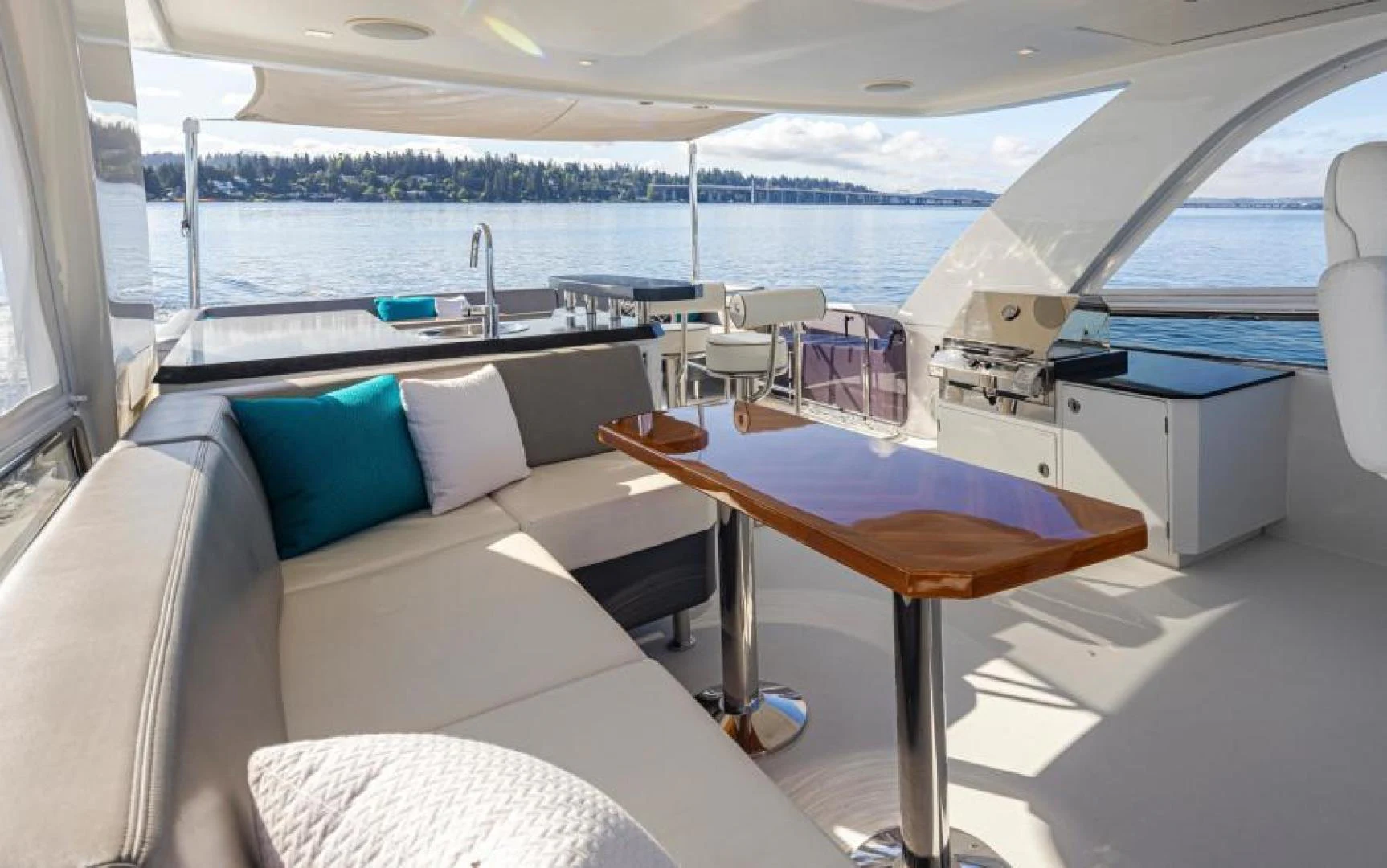 a boat with a table and chairs aboard LIV MAS Yacht for Sale