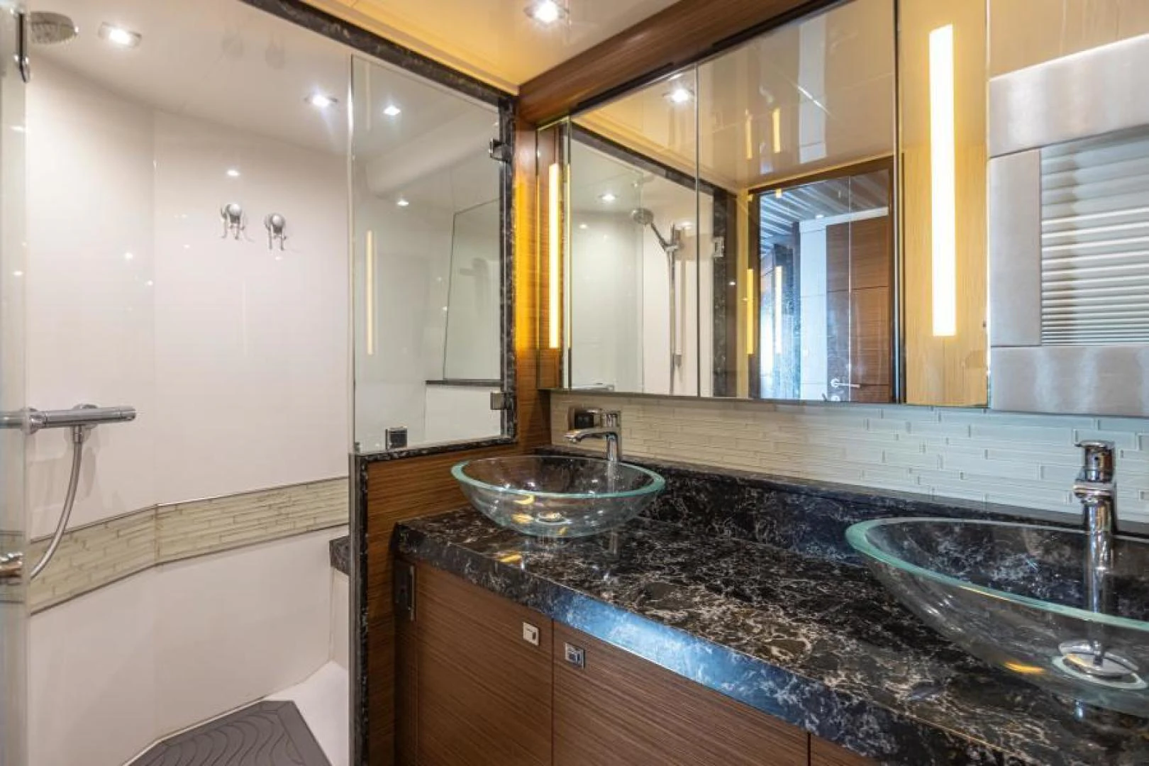 a bathroom with a marble countertop aboard LIV MAS Yacht for Sale