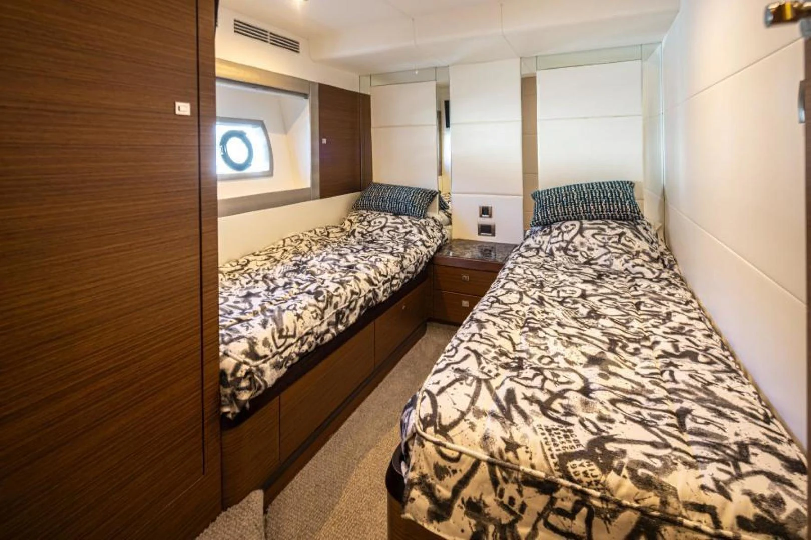 a room with two beds aboard LIV MAS Yacht for Sale