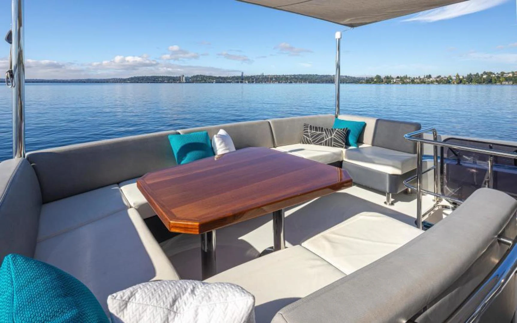 a deck with a view of the water and land aboard LIV MAS Yacht for Sale