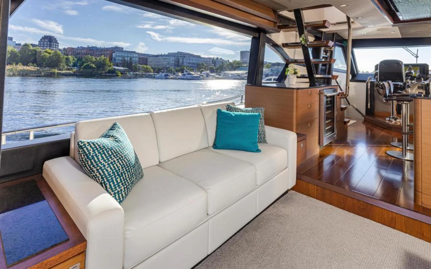a living room with a large window aboard LIV MAS Yacht for Sale