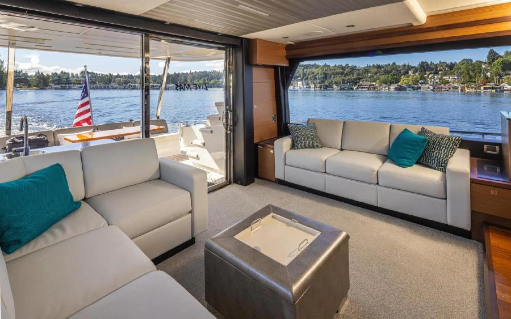 a living room with a large window aboard LIV MAS Yacht for Sale