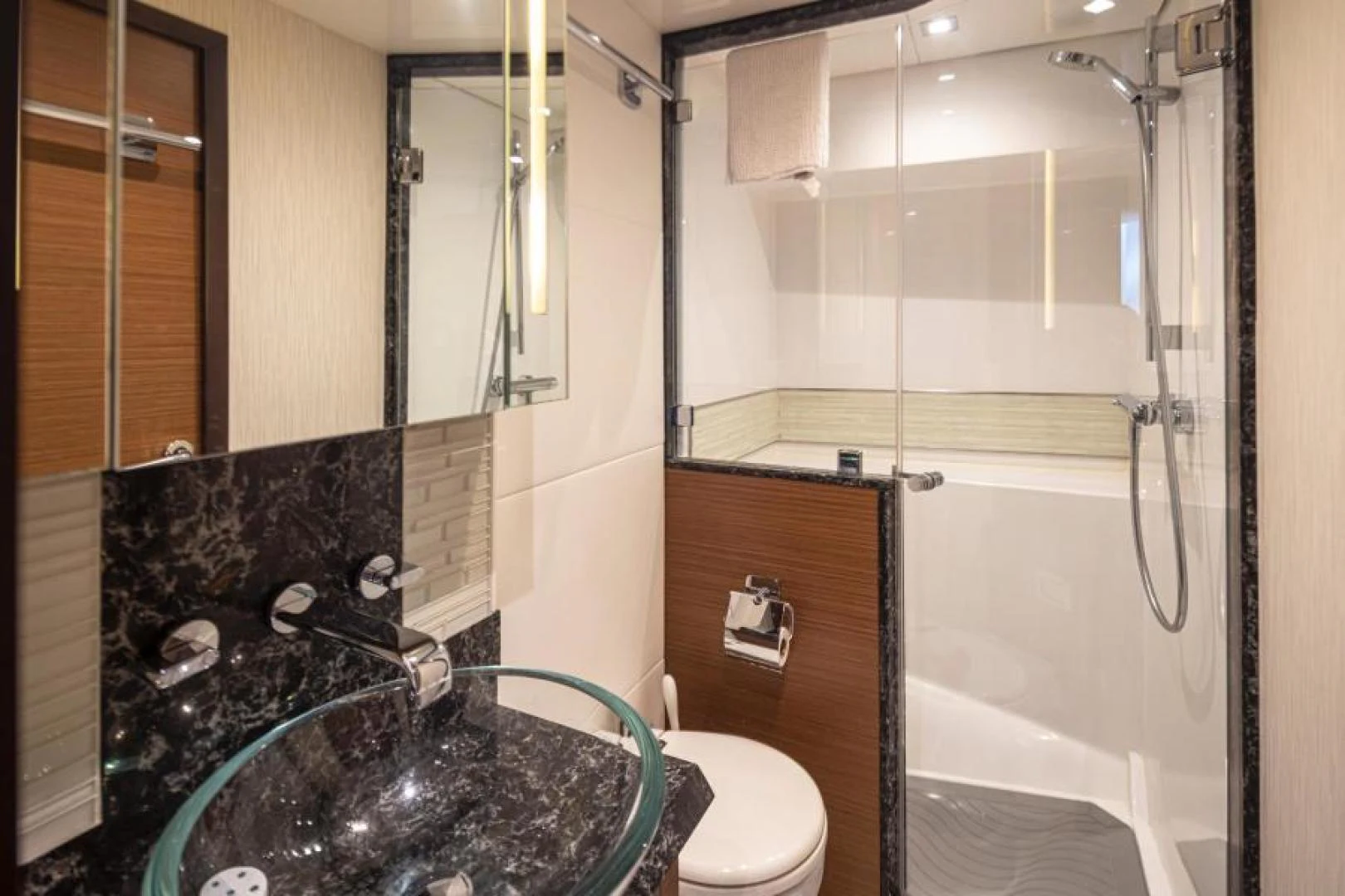 a bathroom with a sink and a shower aboard LIV MAS Yacht for Sale
