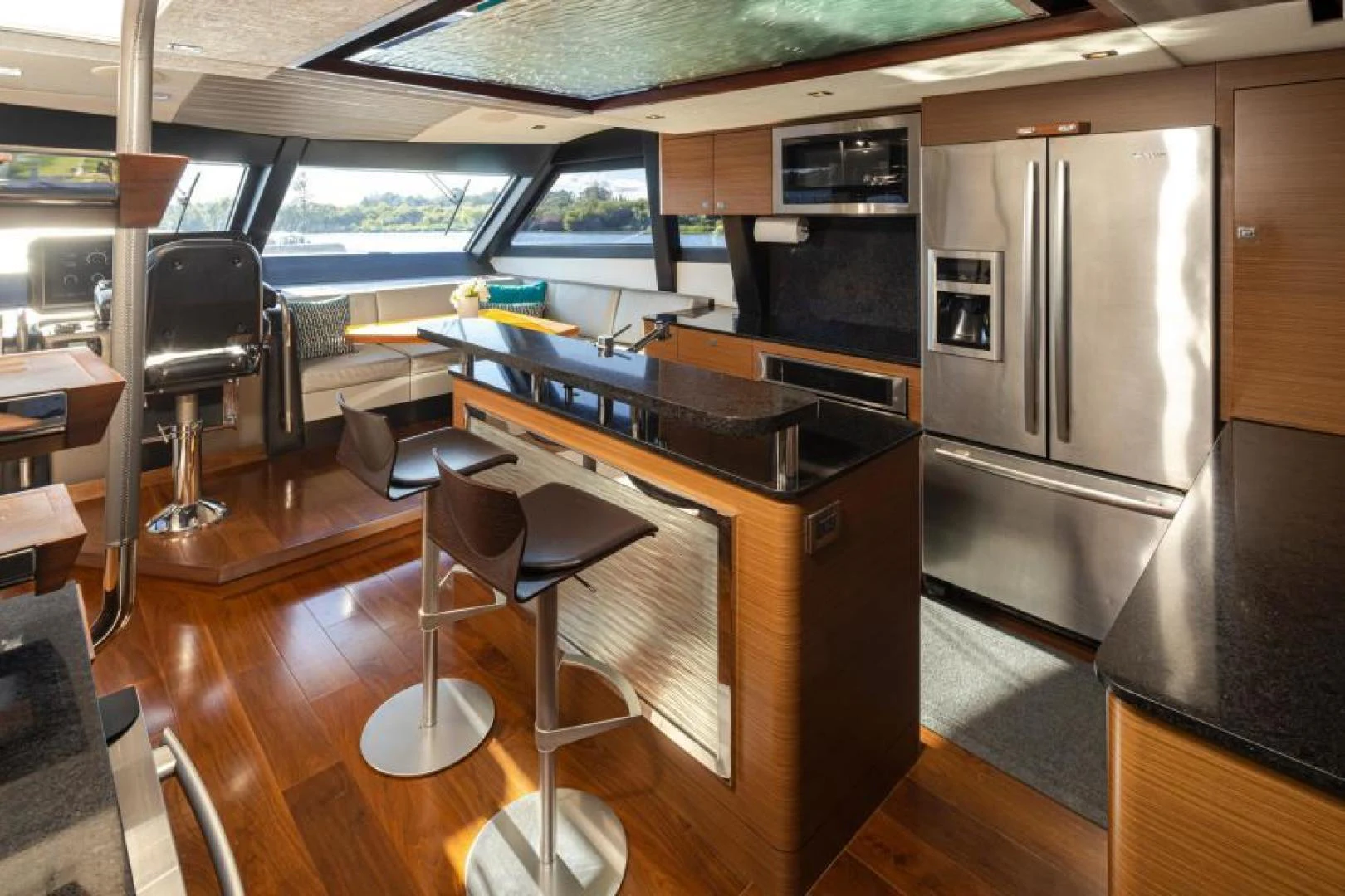 a kitchen with a large island aboard LIV MAS Yacht for Sale