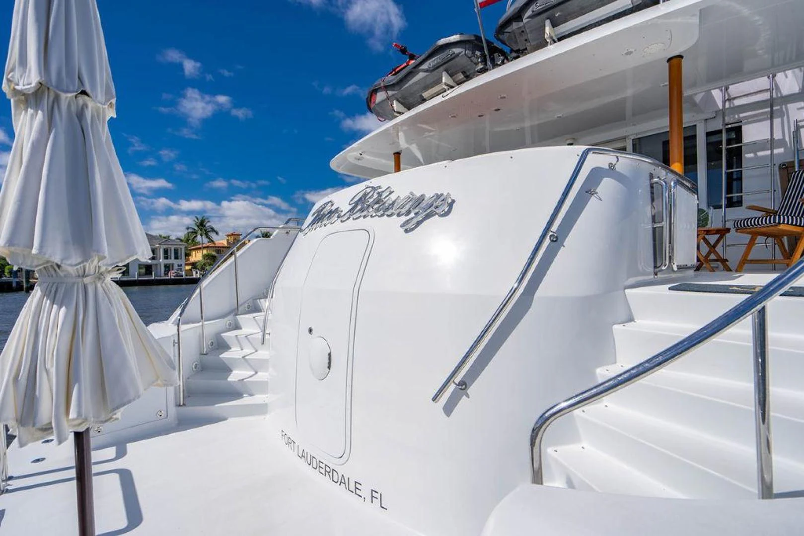 a white boat on a beach aboard THREE BLESSINGS Yacht for Sale