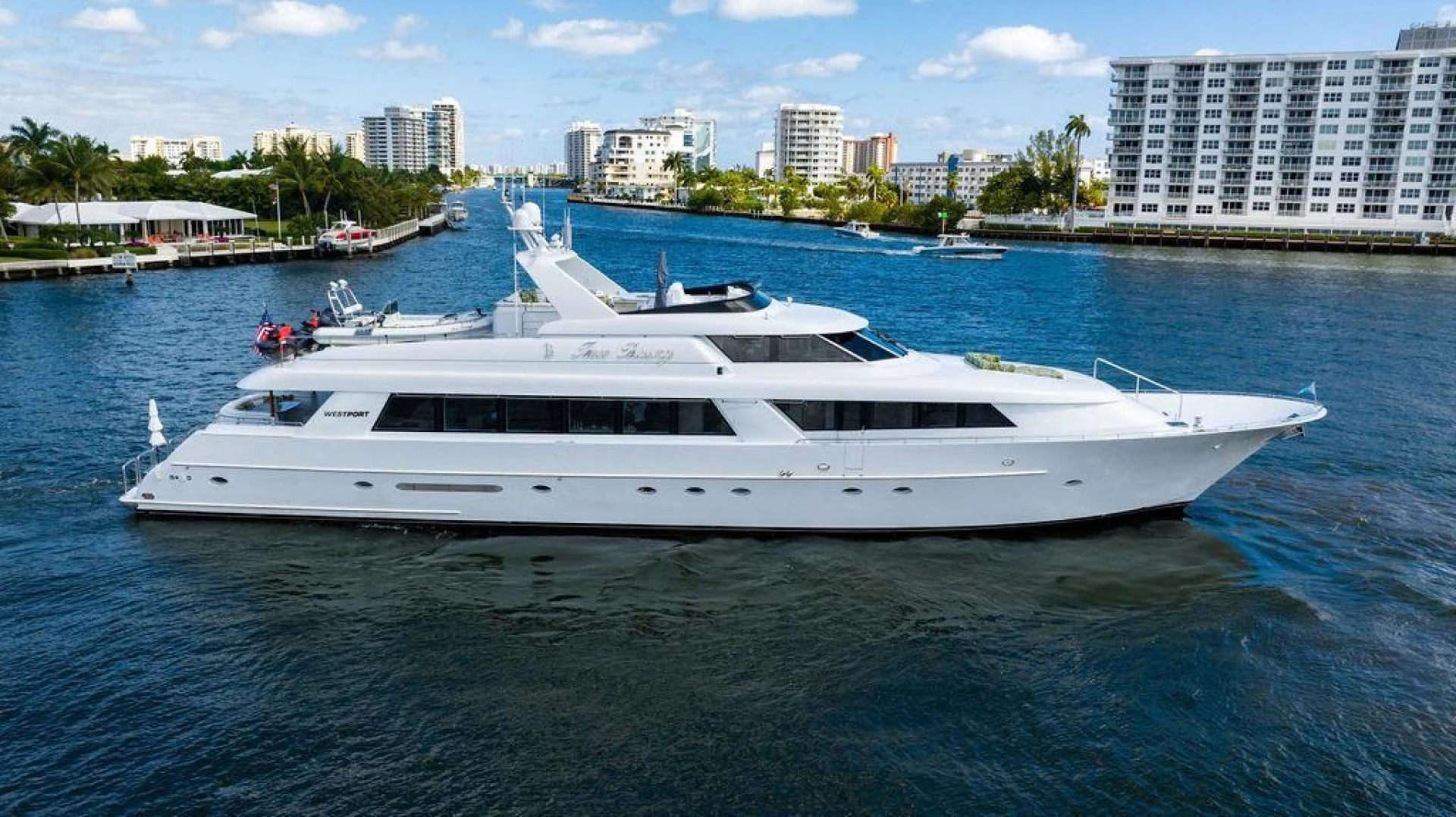 a white yacht in the water aboard THREE BLESSINGS Yacht for Sale