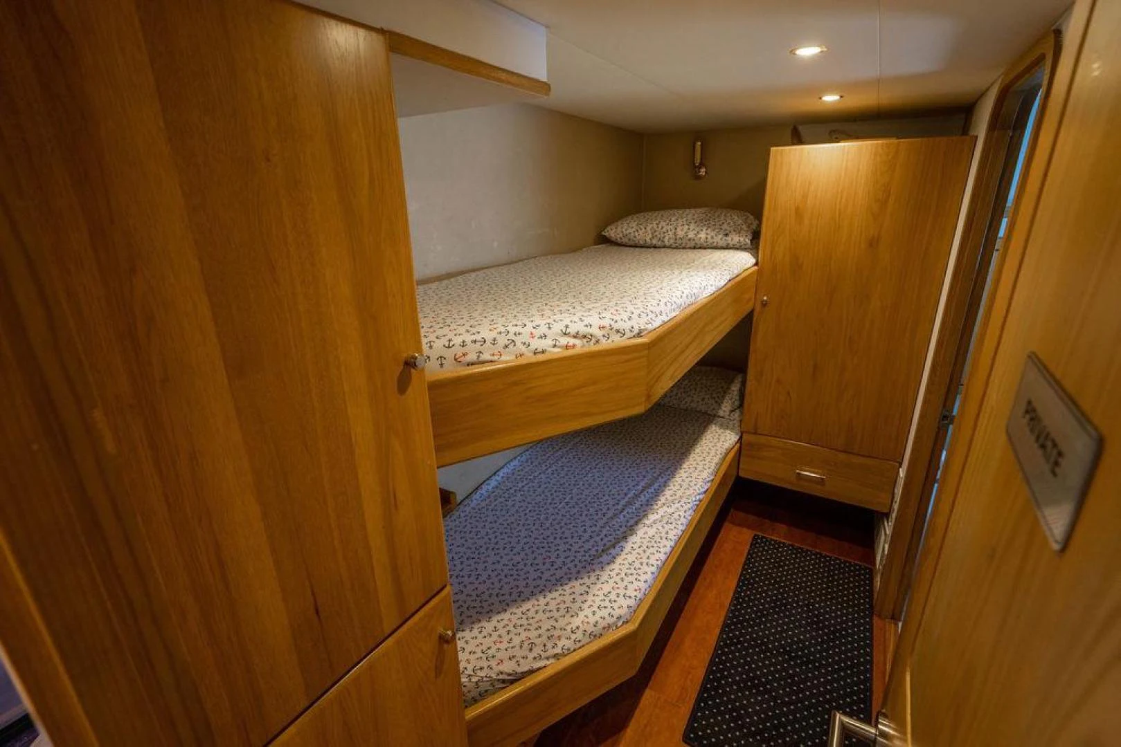 a room with a bed and a closet aboard THREE BLESSINGS Yacht for Sale