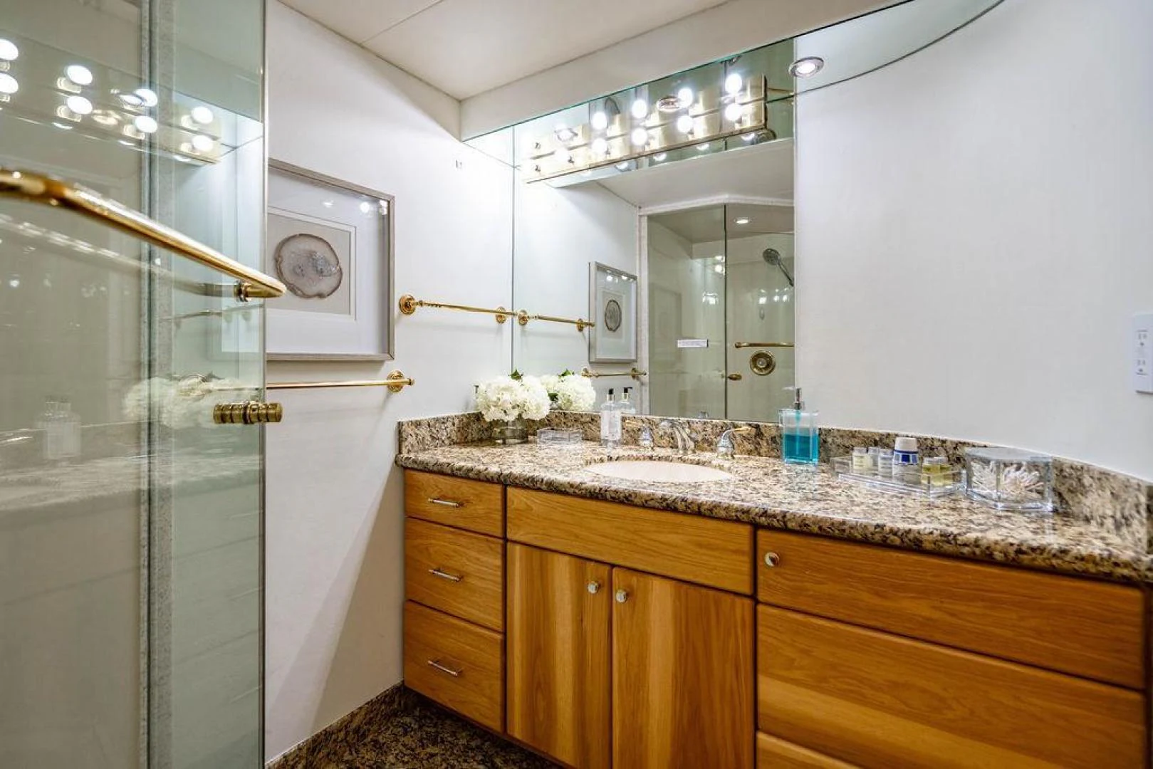 a bathroom with a glass shower aboard THREE BLESSINGS Yacht for Sale