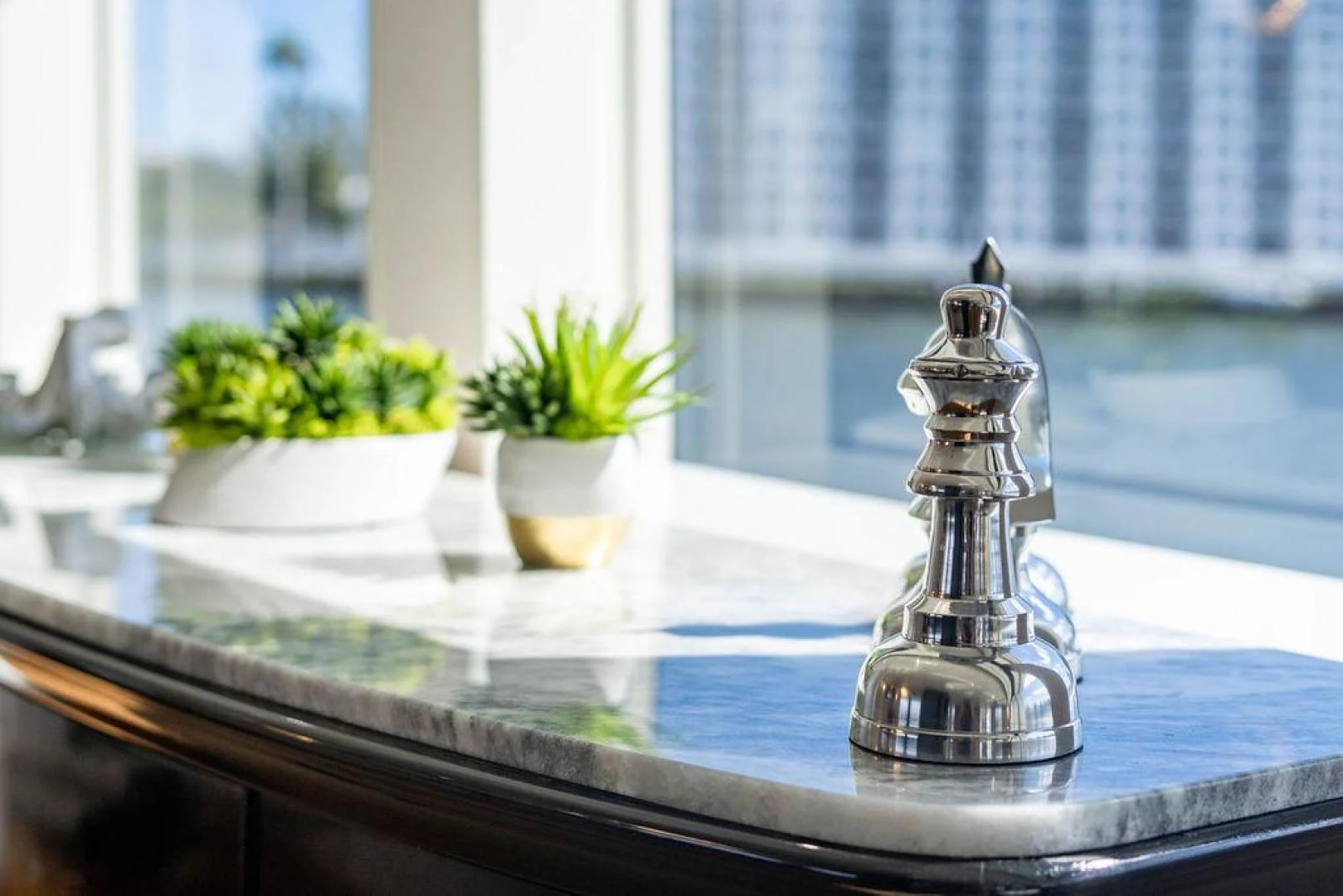 a glass vase with flowers on a window sill aboard THREE BLESSINGS Yacht for Sale