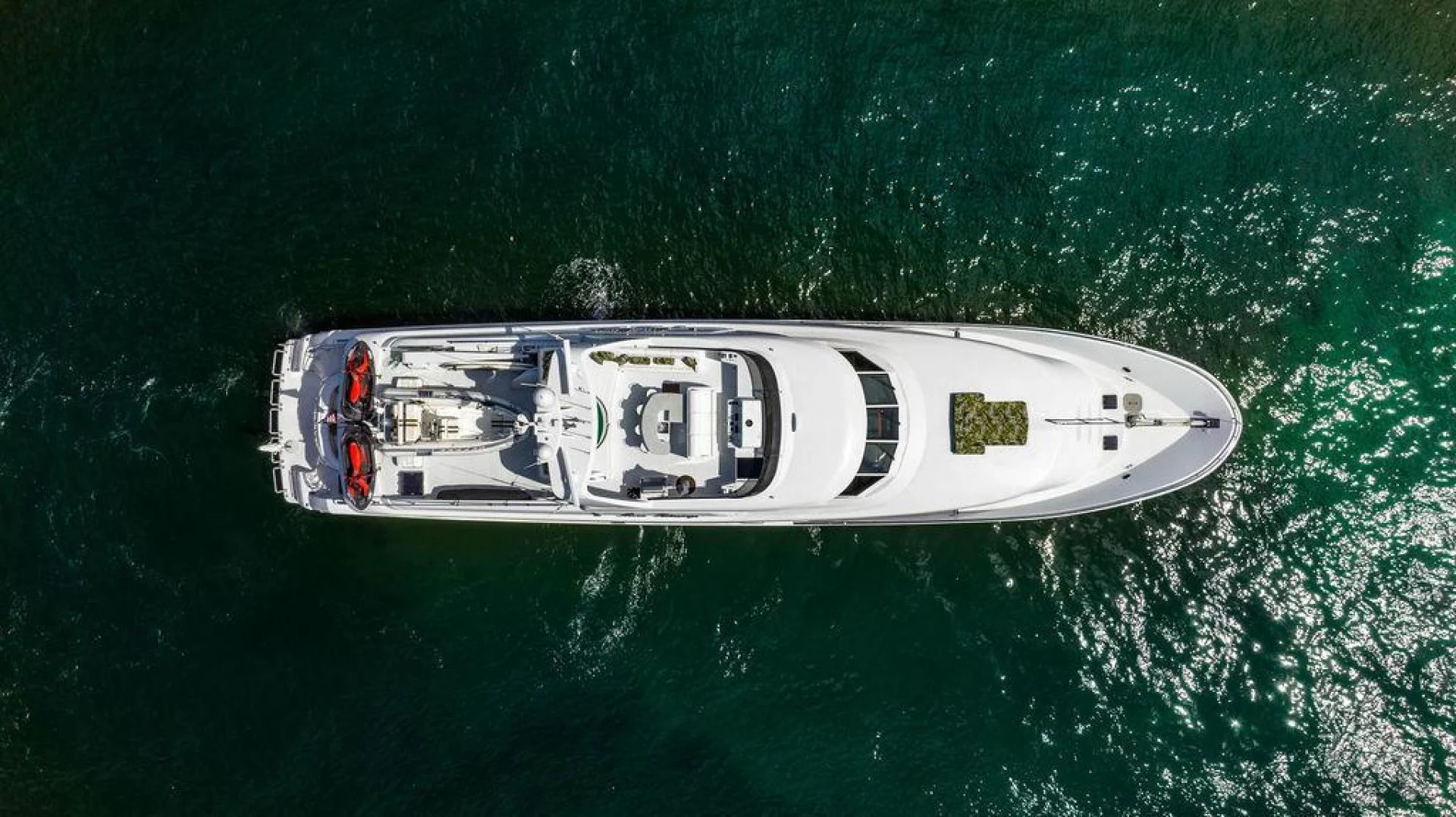 a white and black vehicle in the water aboard THREE BLESSINGS Yacht for Sale