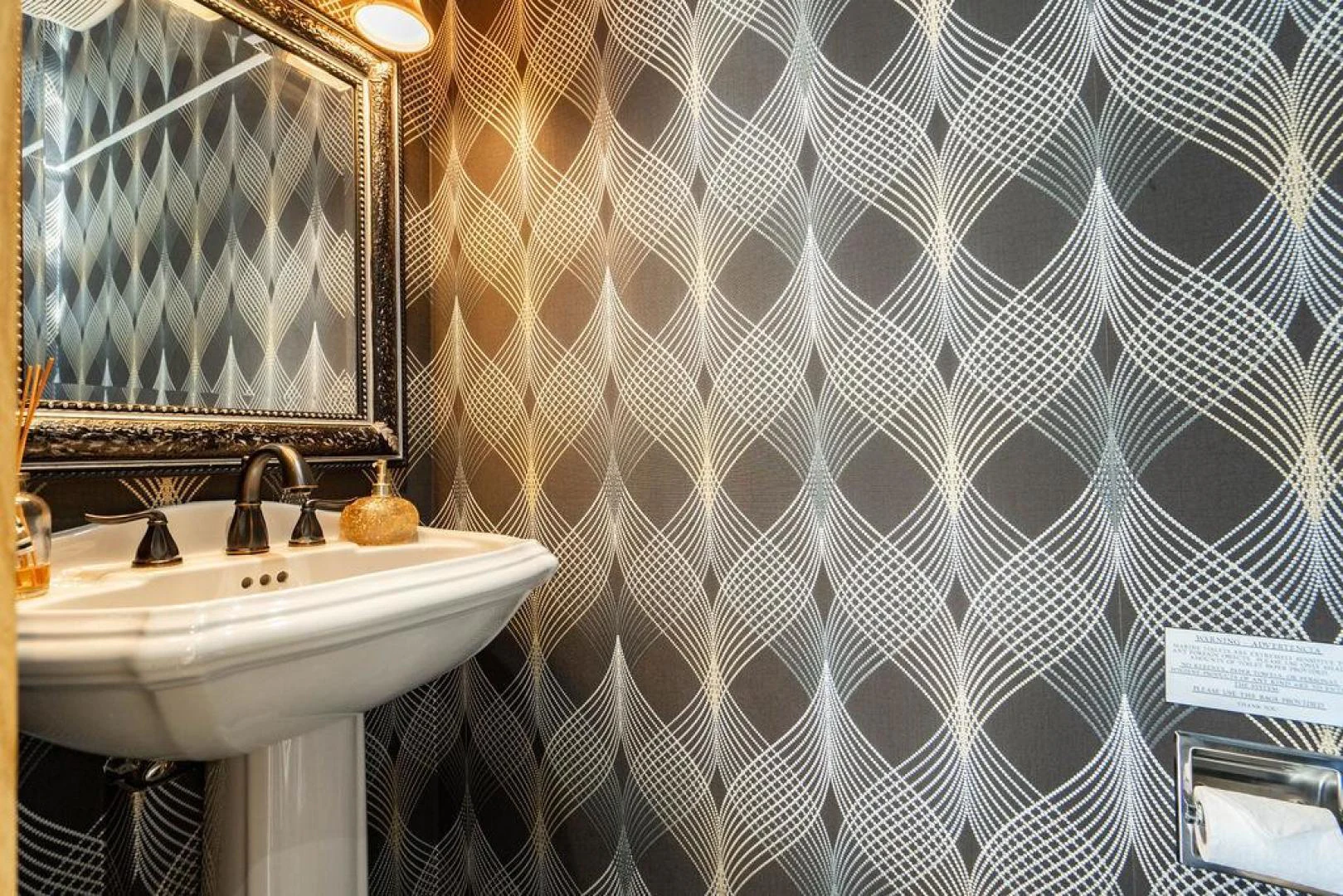 a bathroom with a sink and a mirror aboard THREE BLESSINGS Yacht for Sale
