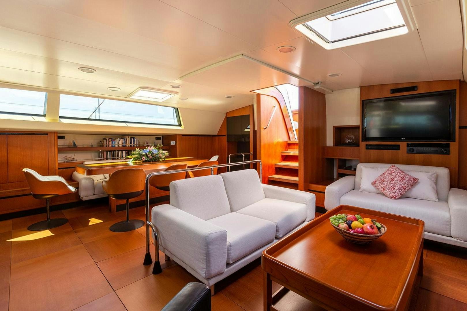 a living room with a couch and a table aboard KENORA Yacht for Sale