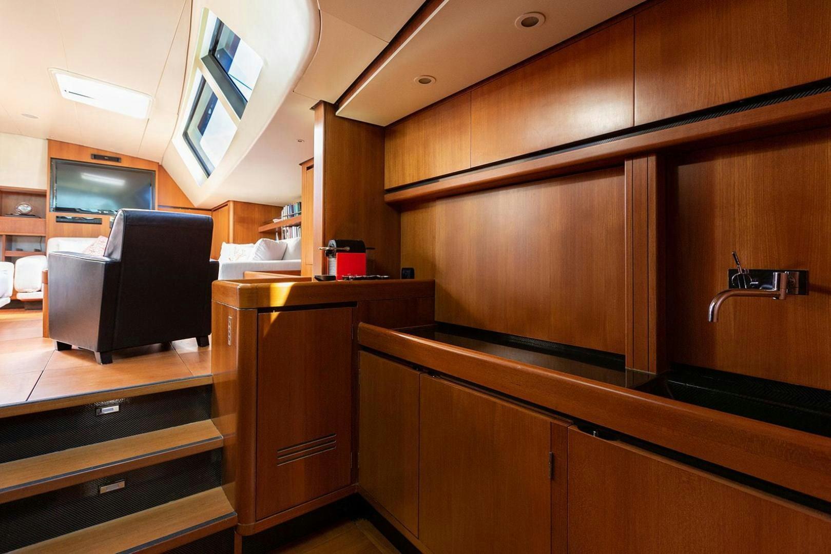 a room with wooden cabinets aboard KENORA Yacht for Sale