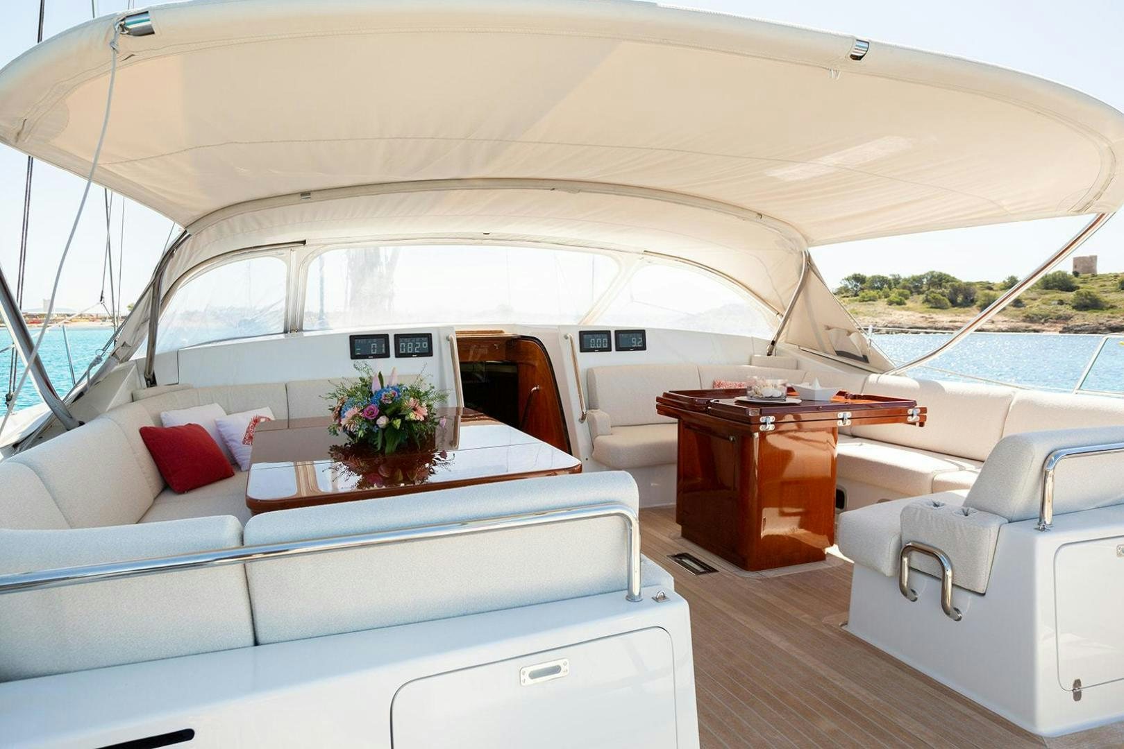 a boat with a table and chairs aboard KENORA Yacht for Sale