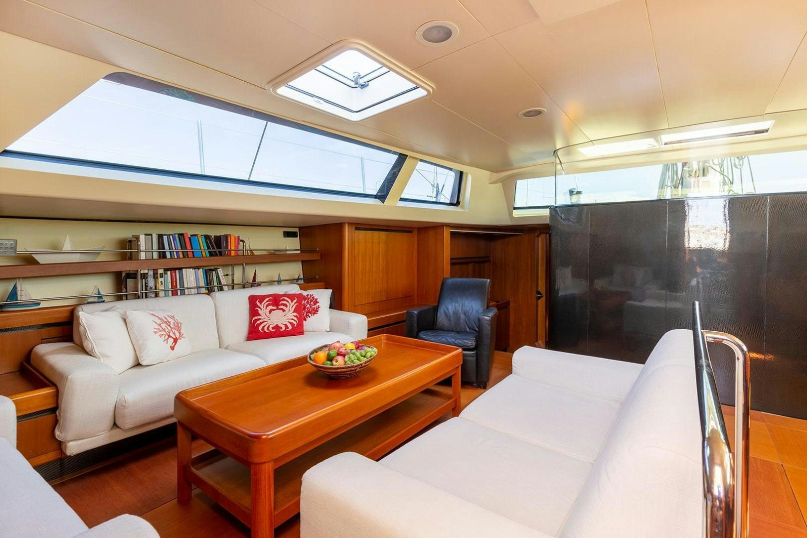 a living room with a couch and a table aboard KENORA Yacht for Sale