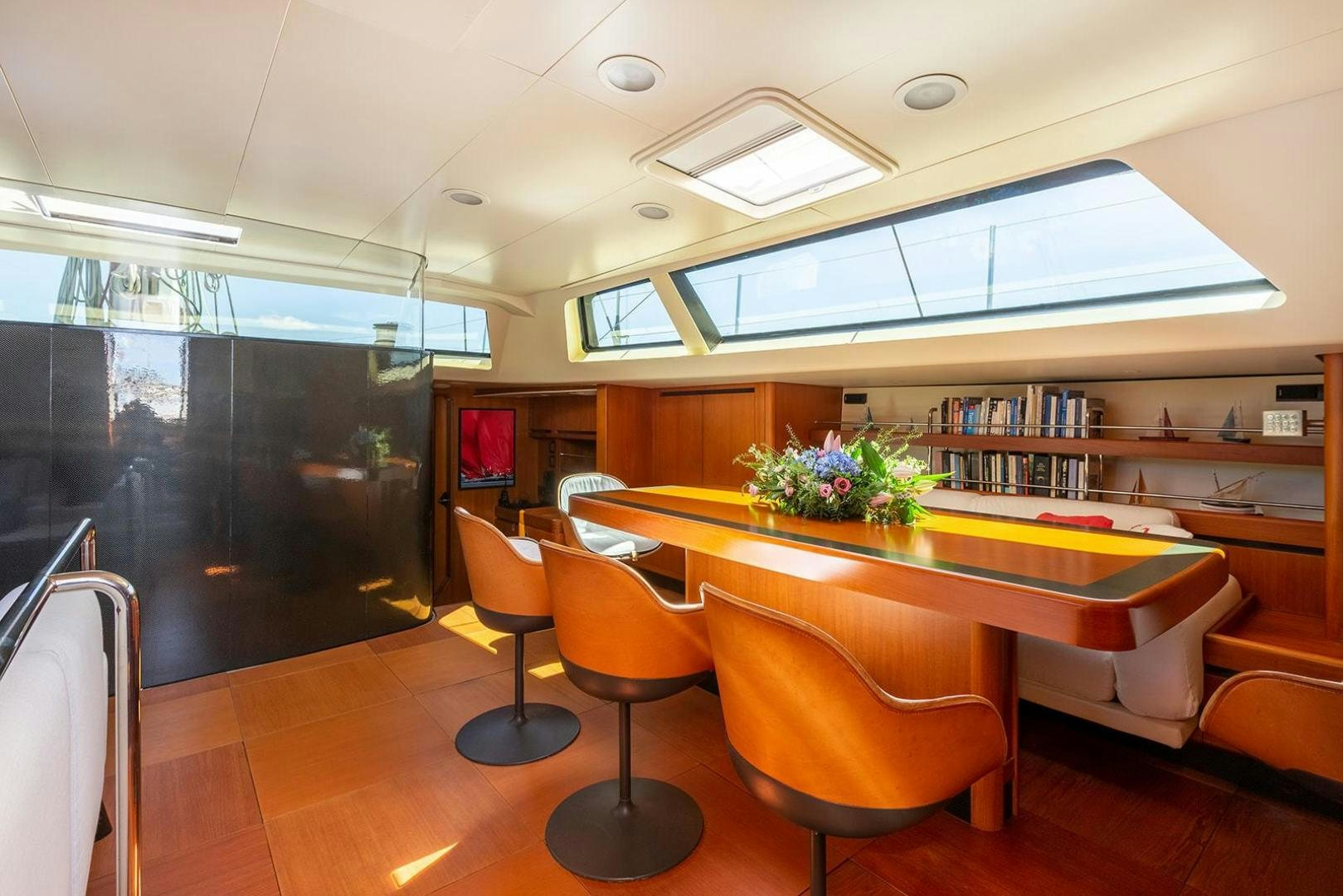 a room with a table and chairs aboard KENORA Yacht for Sale