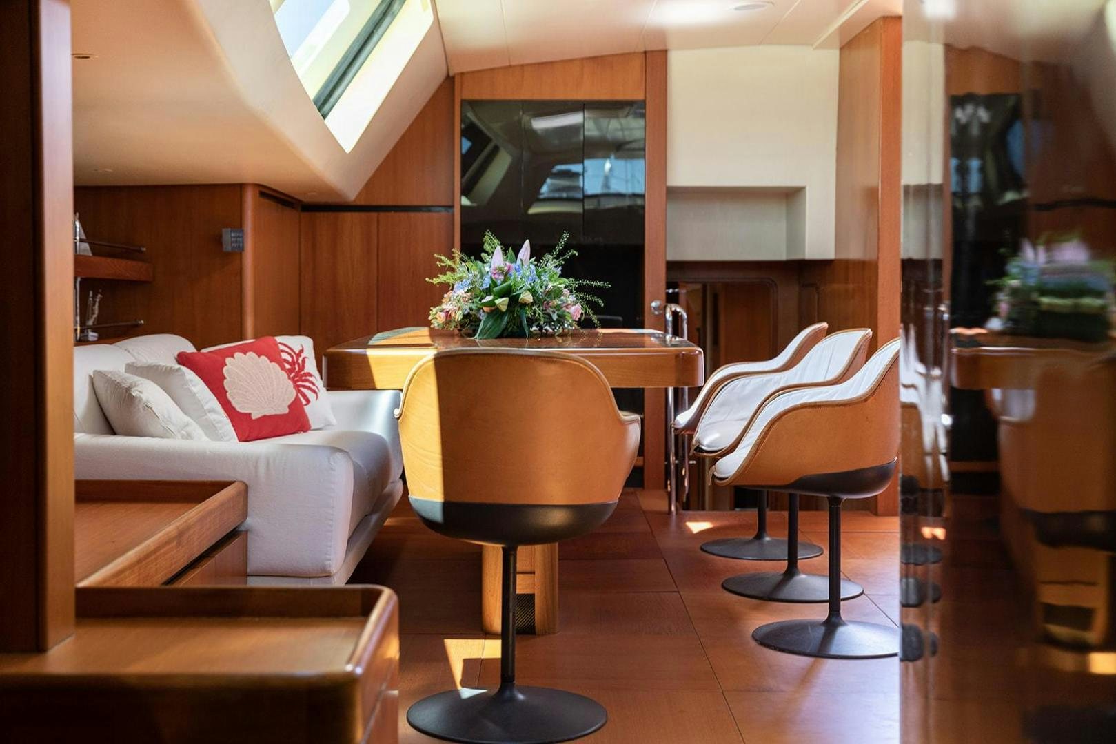 a room with a table and chairs aboard KENORA Yacht for Sale