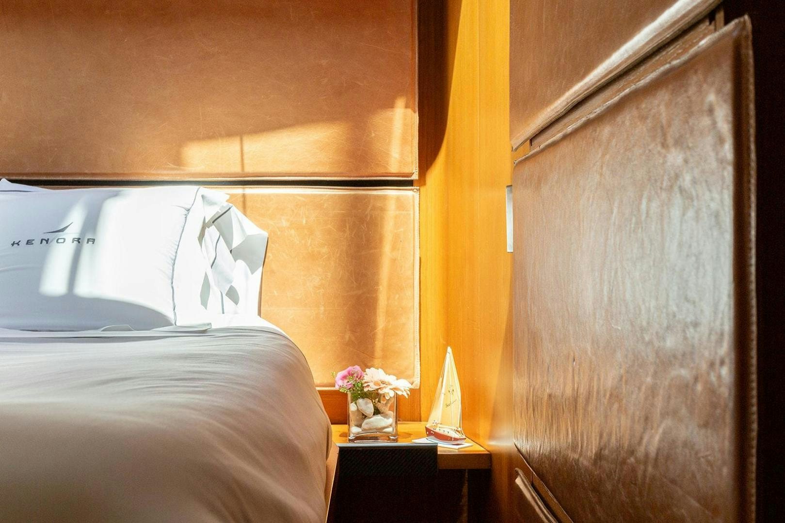 a room with a bed and a couch aboard KENORA Yacht for Sale