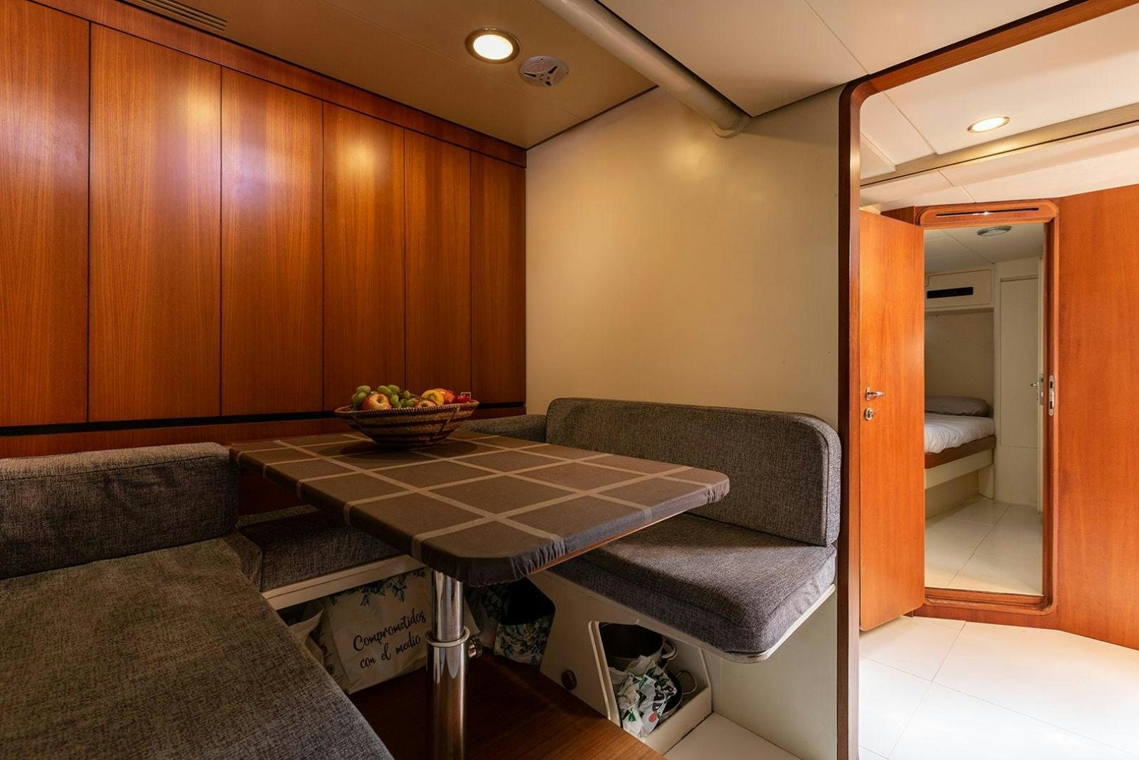 a living room with a couch and a table aboard KENORA Yacht for Sale