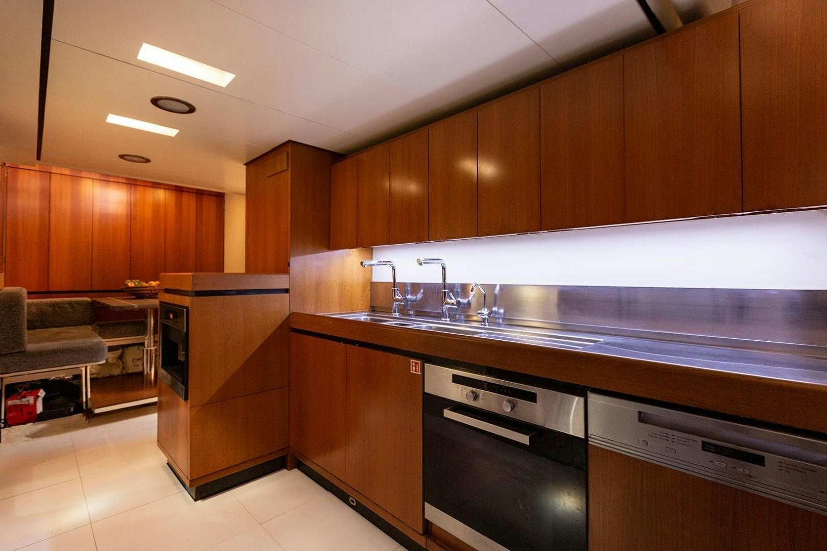 a kitchen with a large island aboard KENORA Yacht for Sale