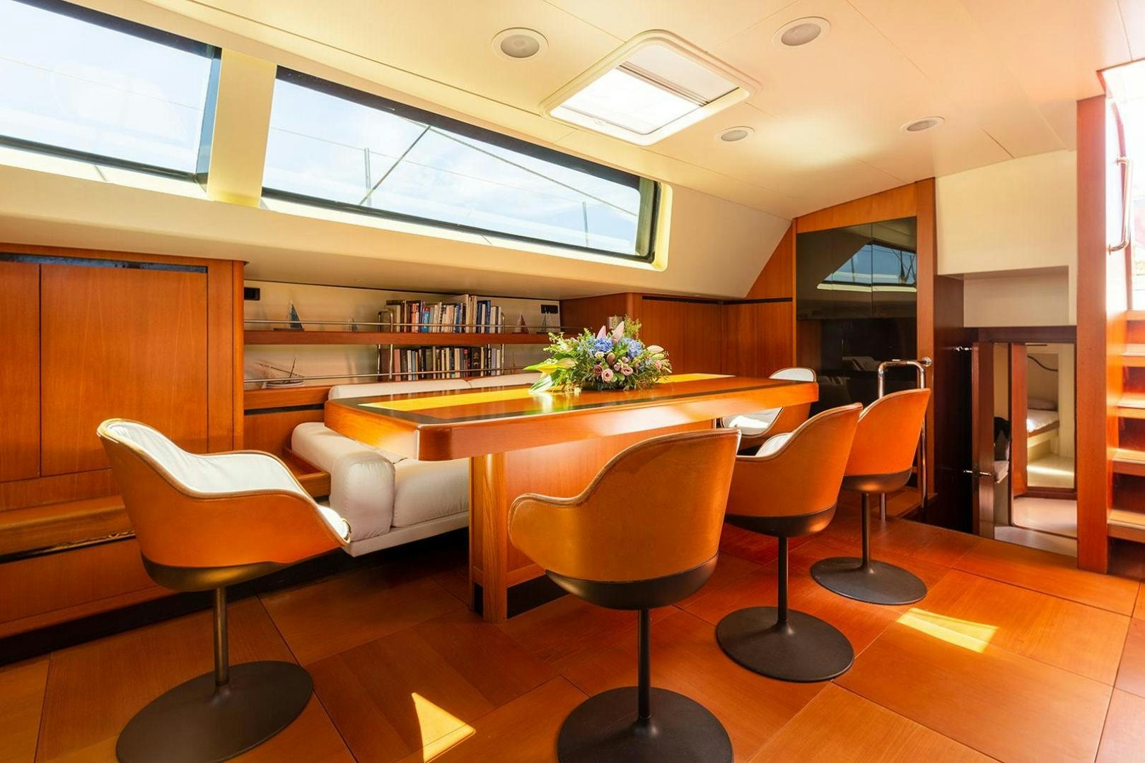 a room with a table and chairs aboard KENORA Yacht for Sale