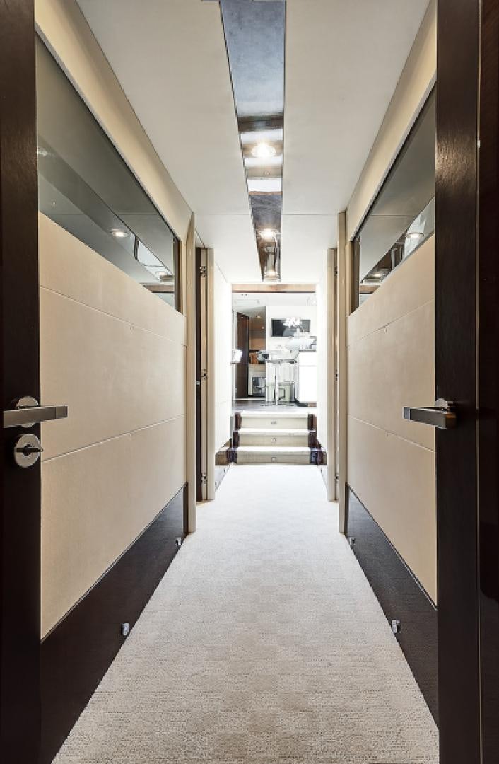 a hallway with doors aboard LADY H Yacht for Sale