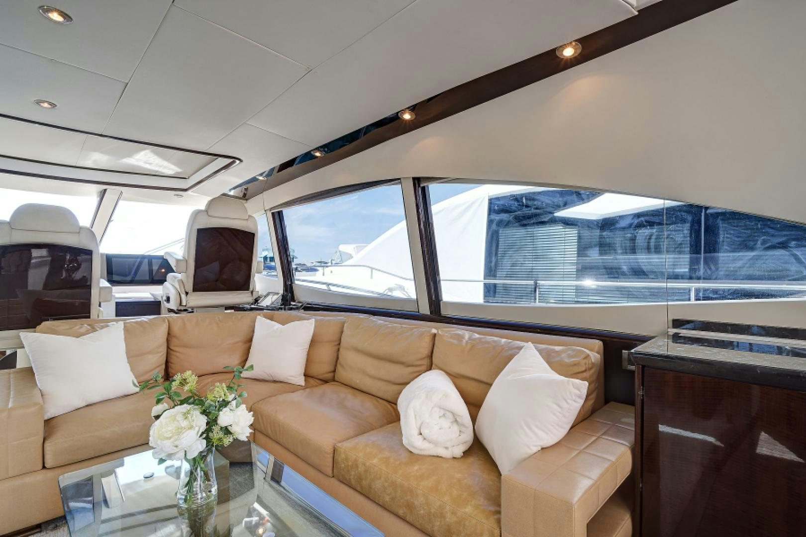 a living room with a large window aboard LADY H Yacht for Sale