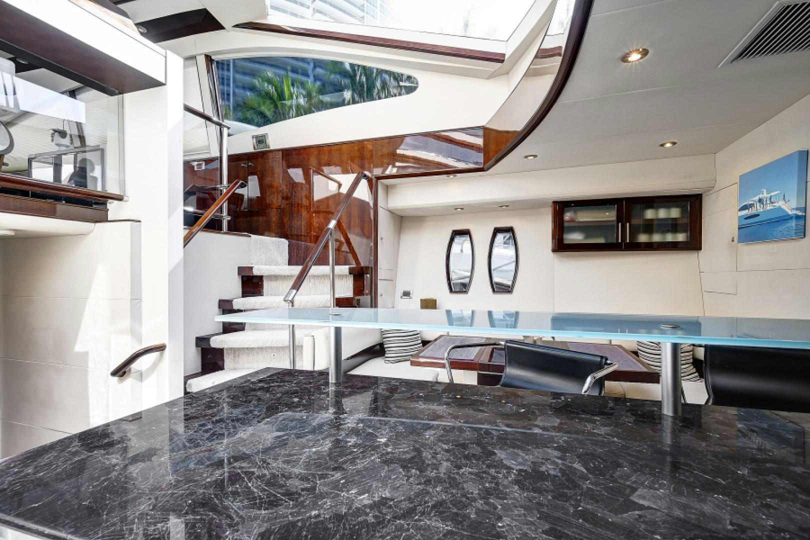 a room with a pool table and chairs aboard LADY H Yacht for Sale