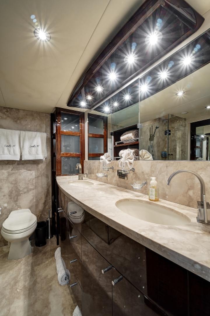 a bathroom with a large mirror aboard LADY H Yacht for Sale
