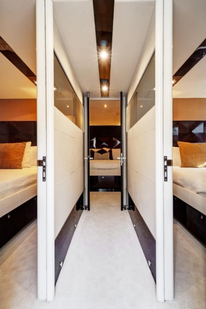 a hallway with white walls aboard LADY H Yacht for Sale