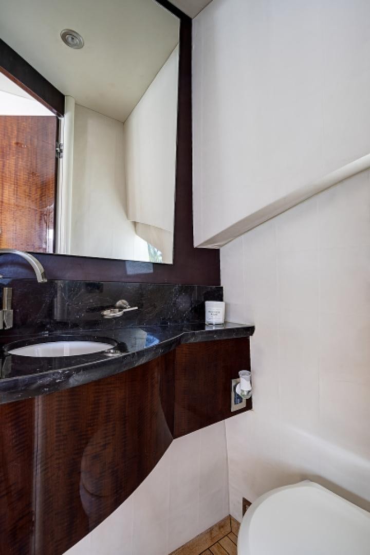 a bathroom with a sink and a mirror aboard LADY H Yacht for Sale