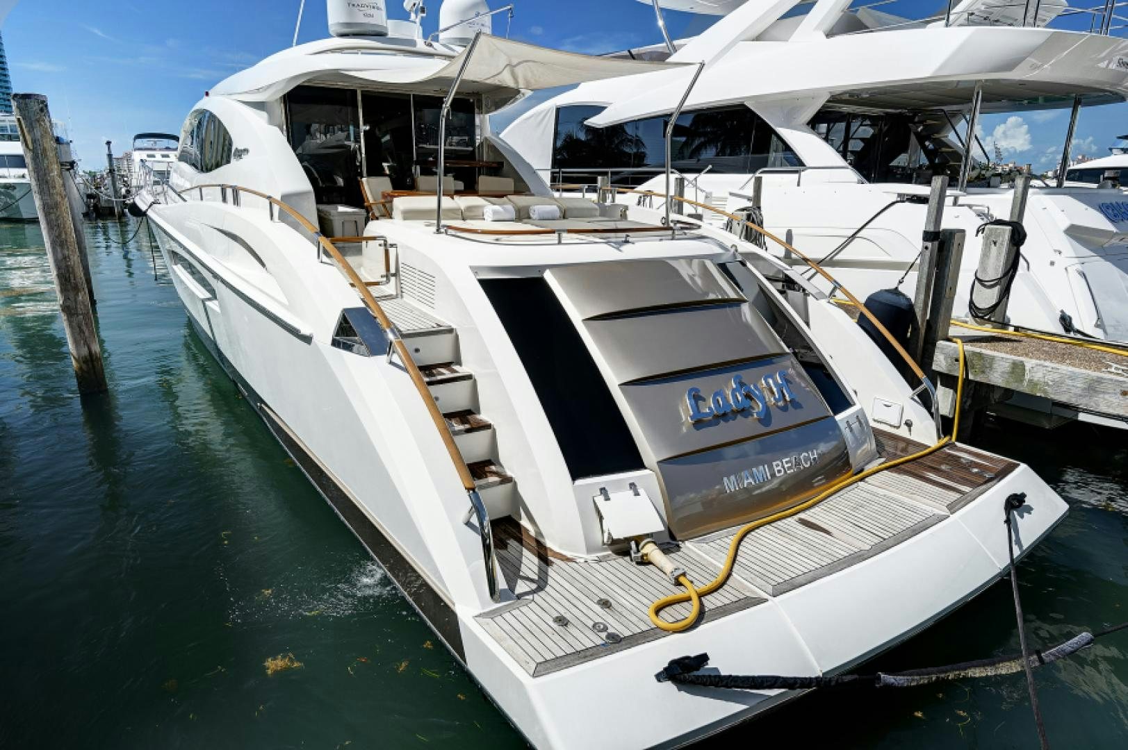 a boat docked at a pier aboard LADY H Yacht for Sale