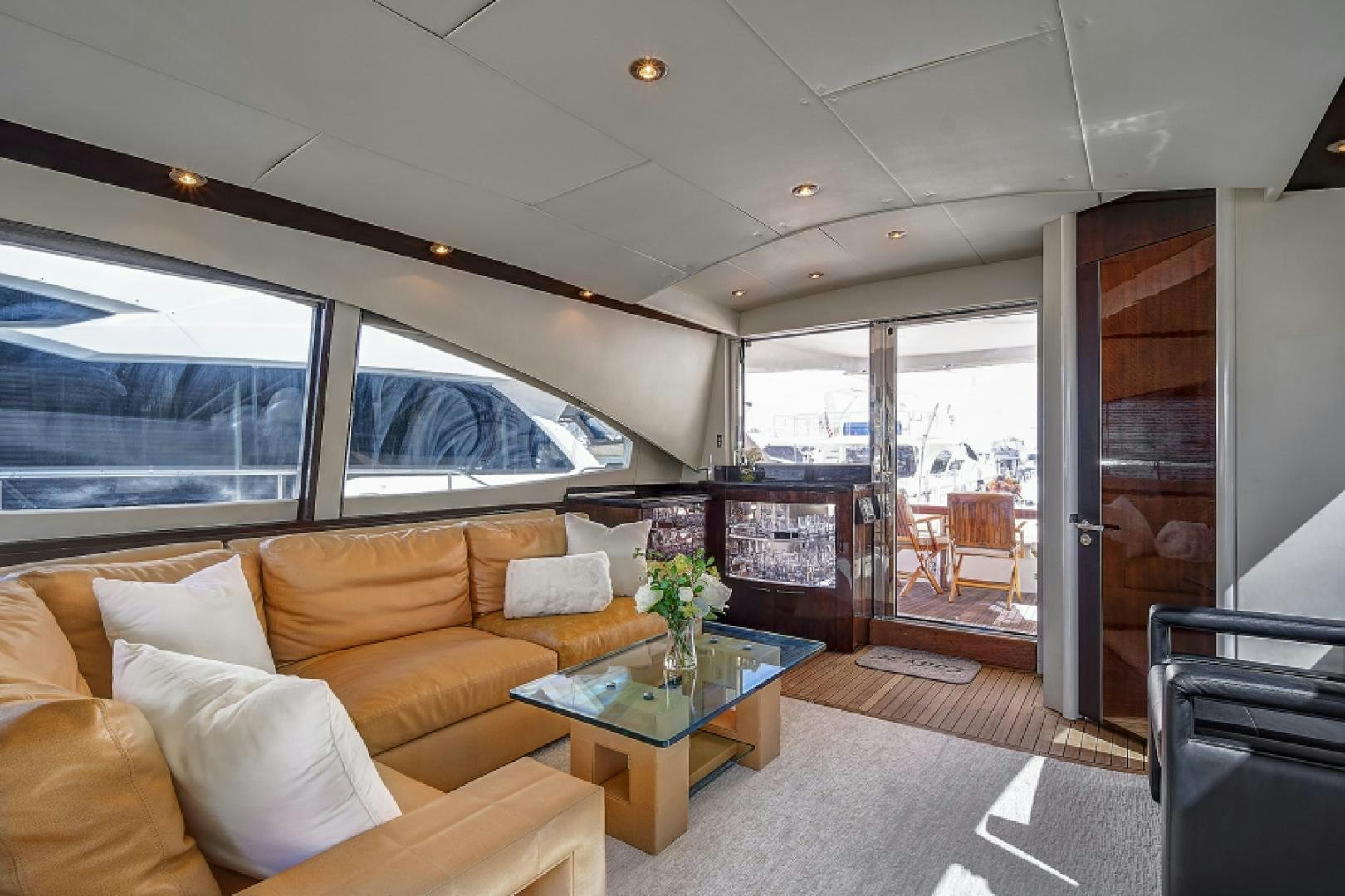 a living room with a large window aboard LADY H Yacht for Sale