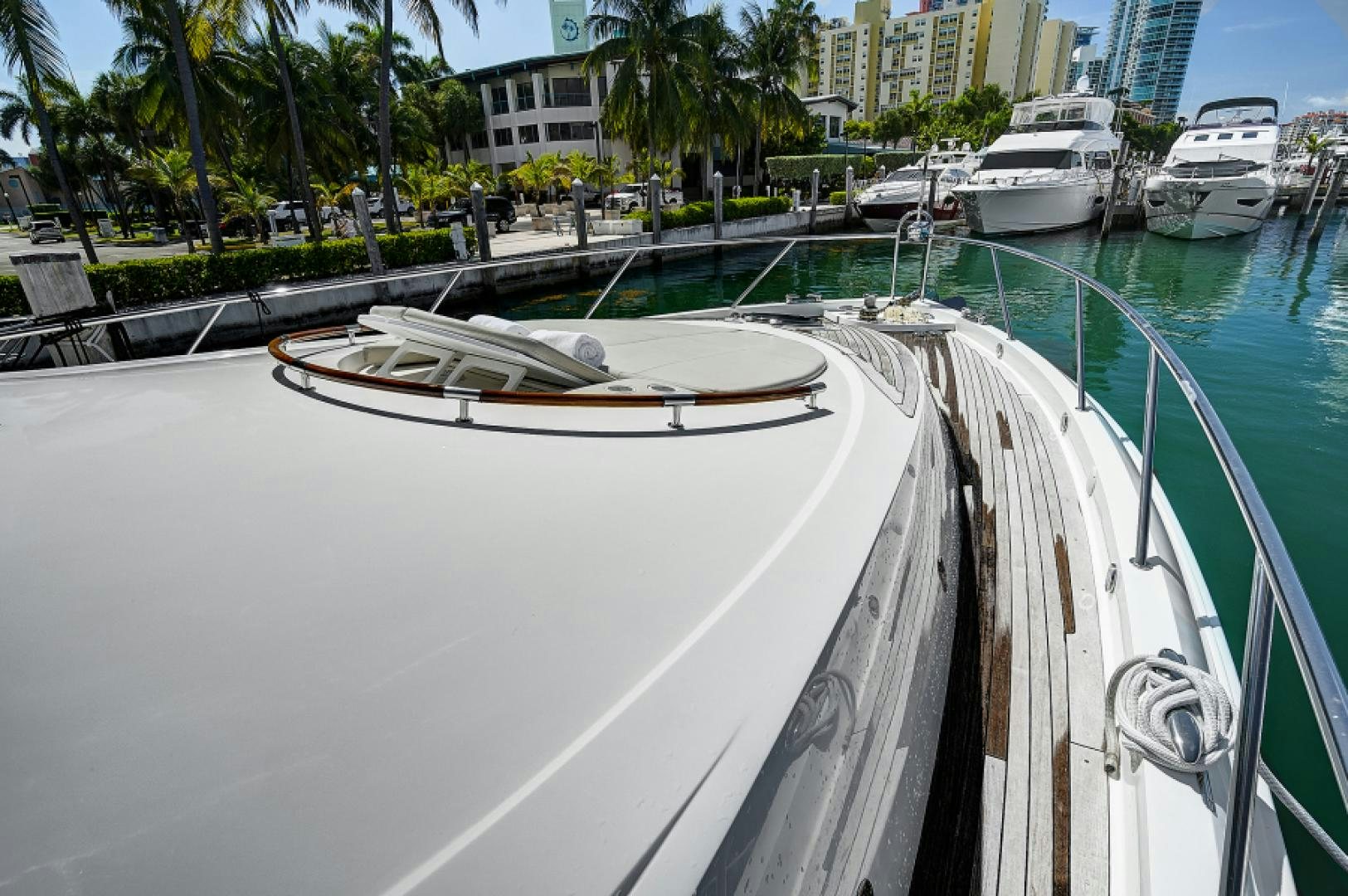 a boat is parked on the side of a river aboard LADY H Yacht for Sale