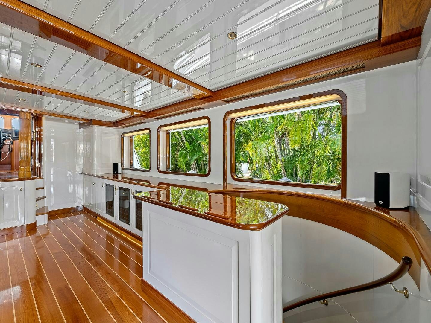 a large room with a wood floor aboard SIENNA Yacht for Sale