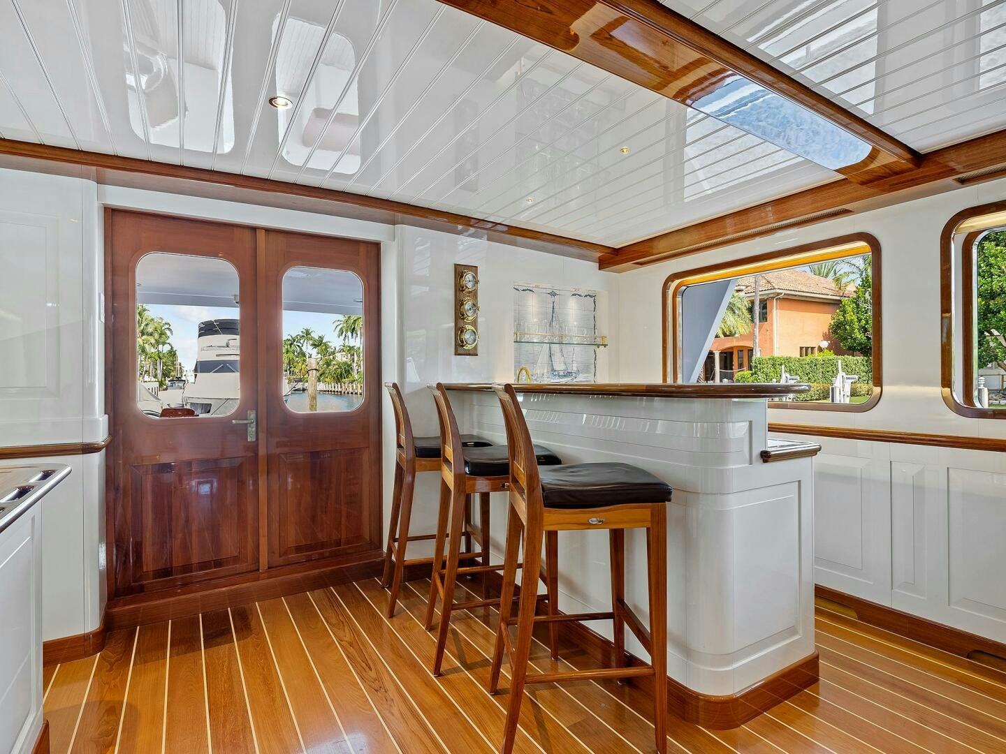 a kitchen with a table and chairs aboard SIENNA Yacht for Sale